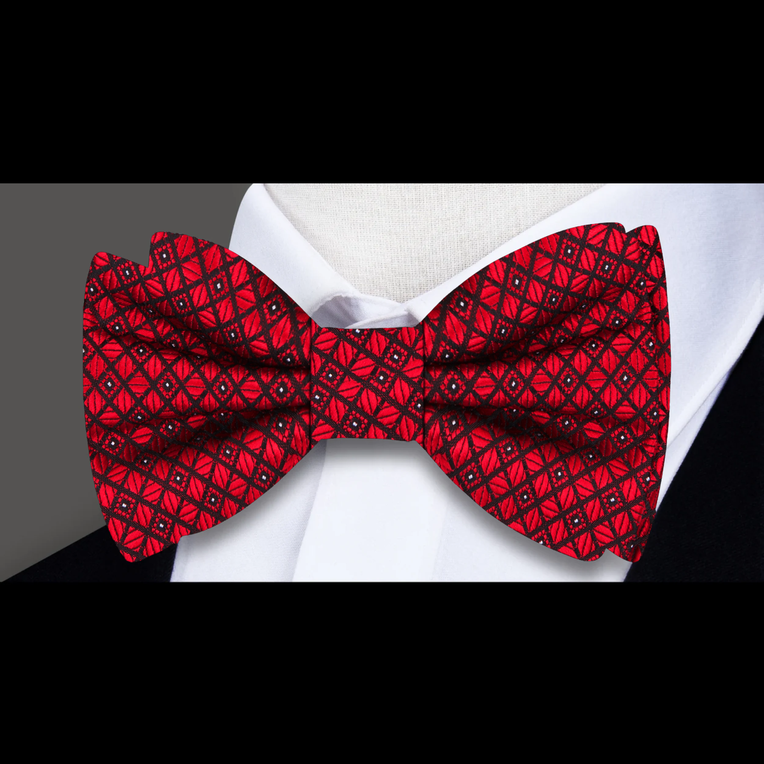 Close-up of the fabric and pattern of the best checkered bow tie for men in deep red and blue tones