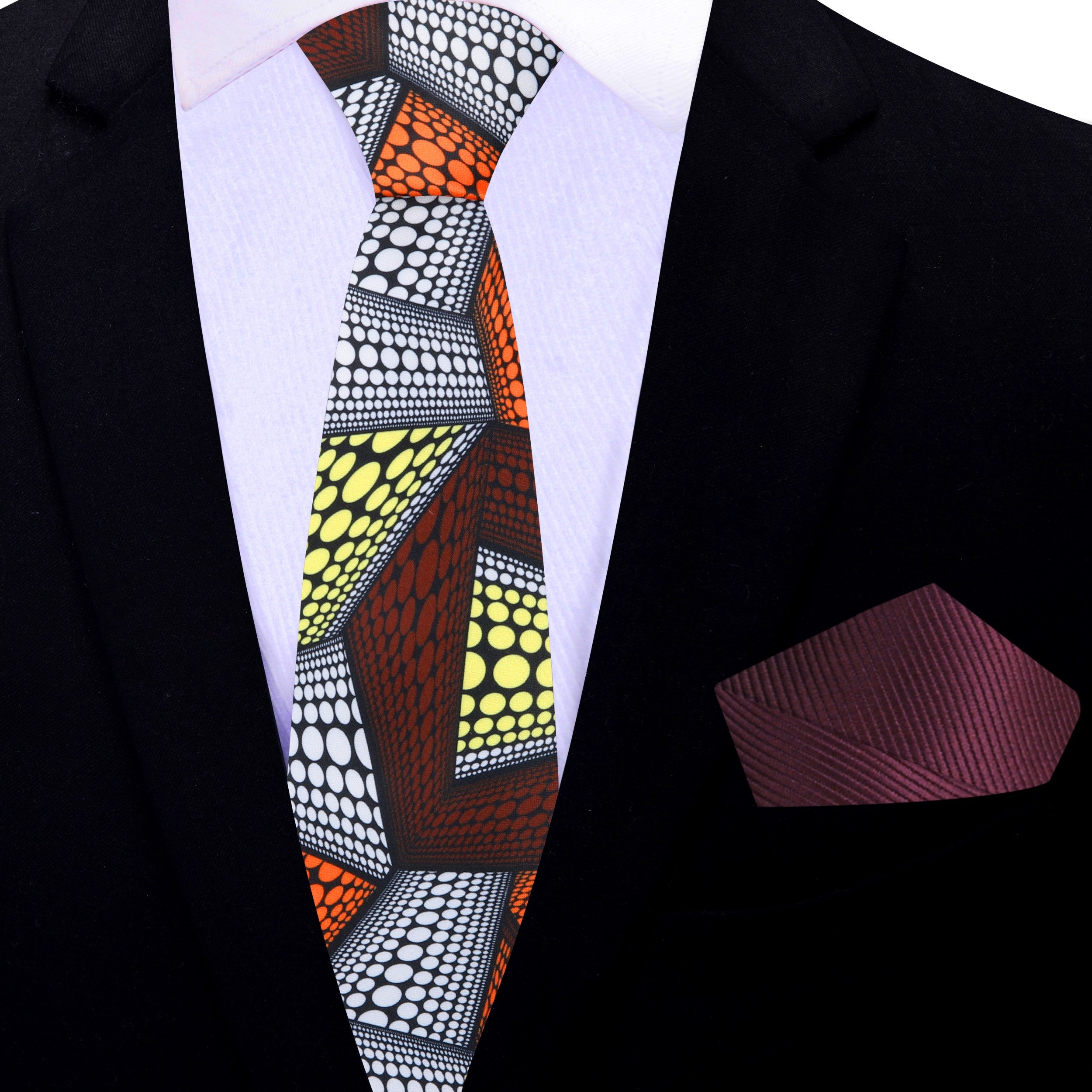Styled with a navy suit and white shirt for a wedding or celebration