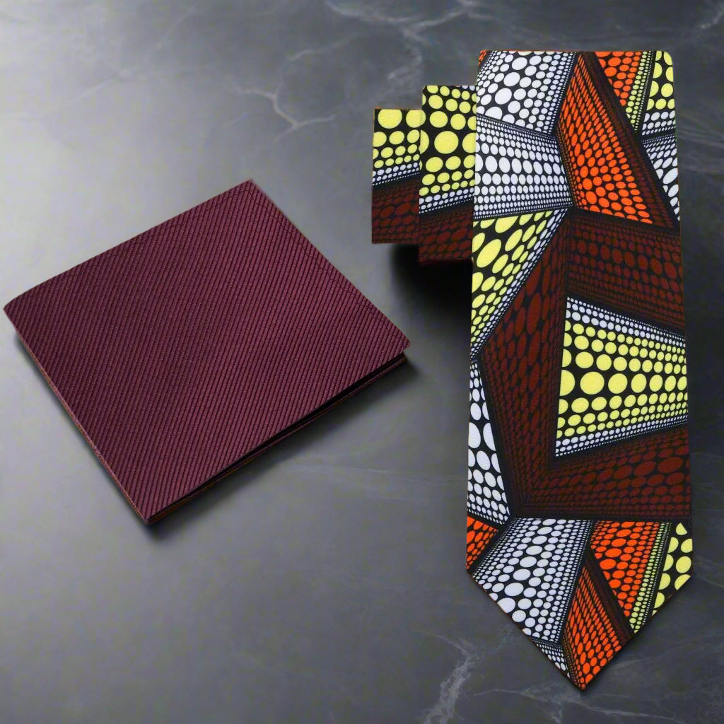 Vibrant Kente pattern silk necktie displayed against a white shirt for formal wear