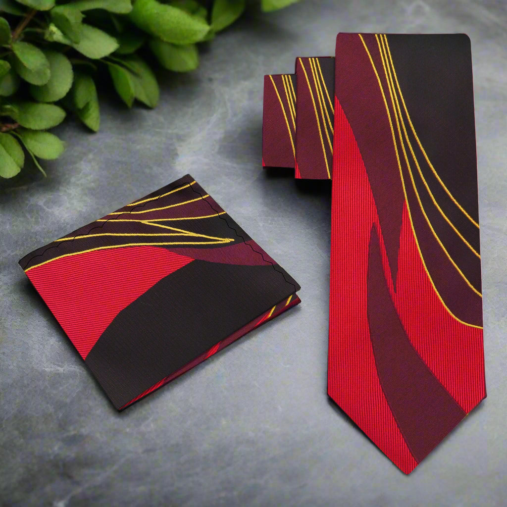 Close-up view of the silk tie and pocket square set, highlighting the abstract design and rich fabric texture.