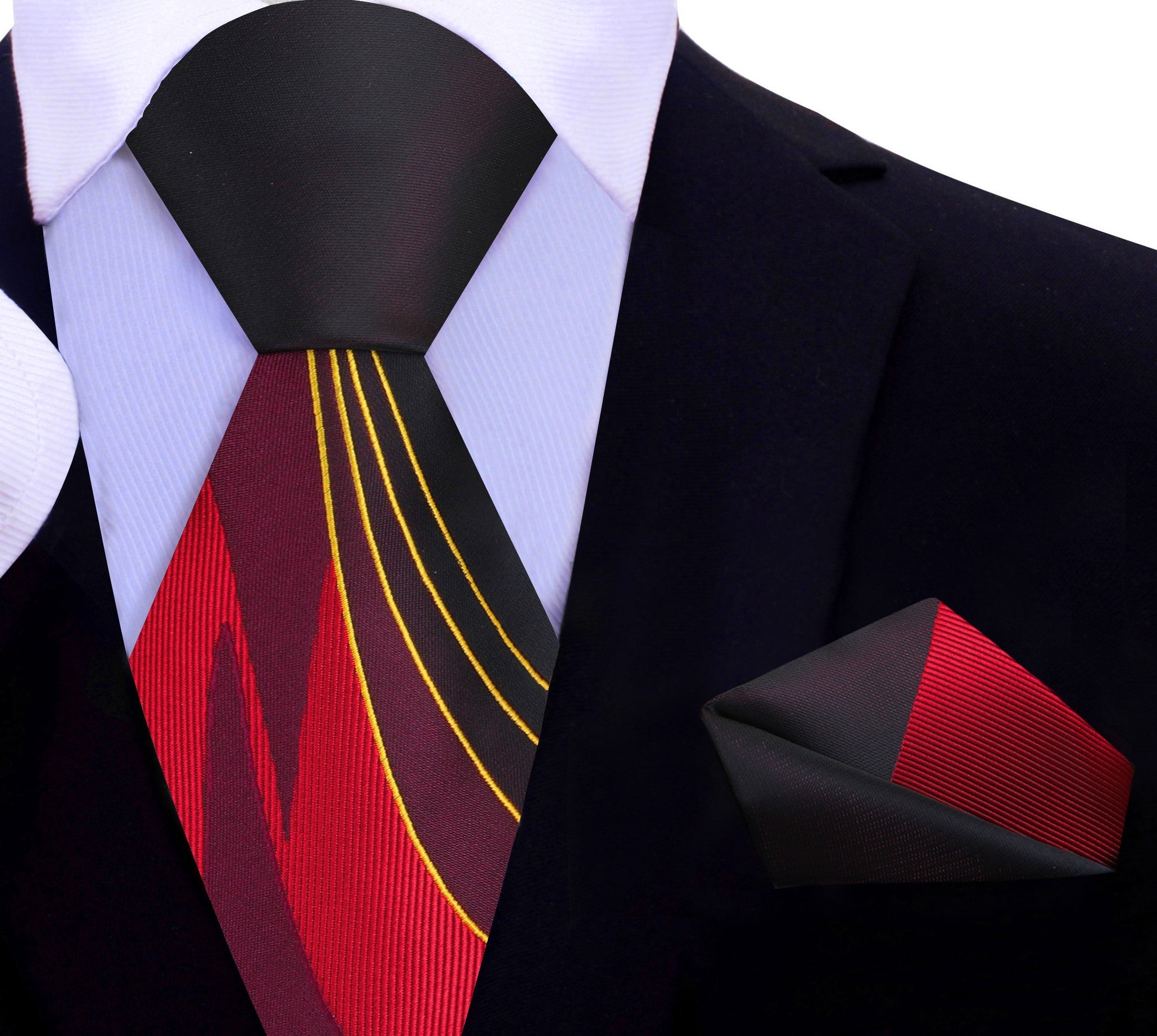 An elegant presentation of the necktie set styled with a navy suit and white dress shirt, perfect for evening events.