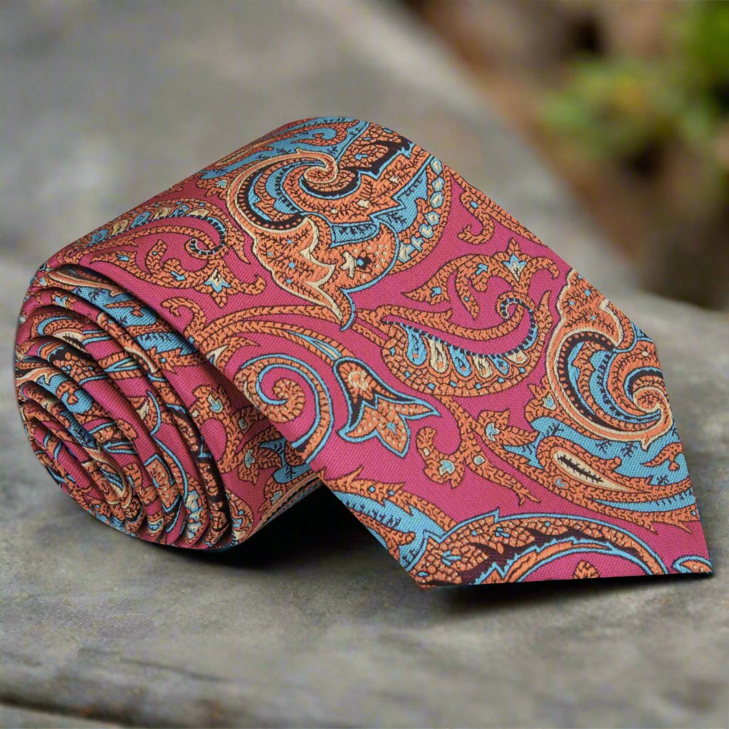 Close-up of vibrant paisley silk necktie in bright colors