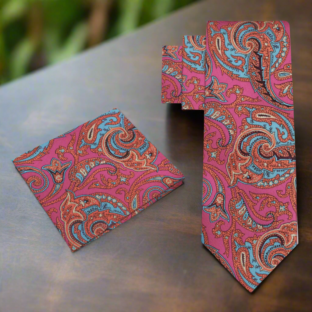 Styled mens paisley tie with white dress shirt and navy suit