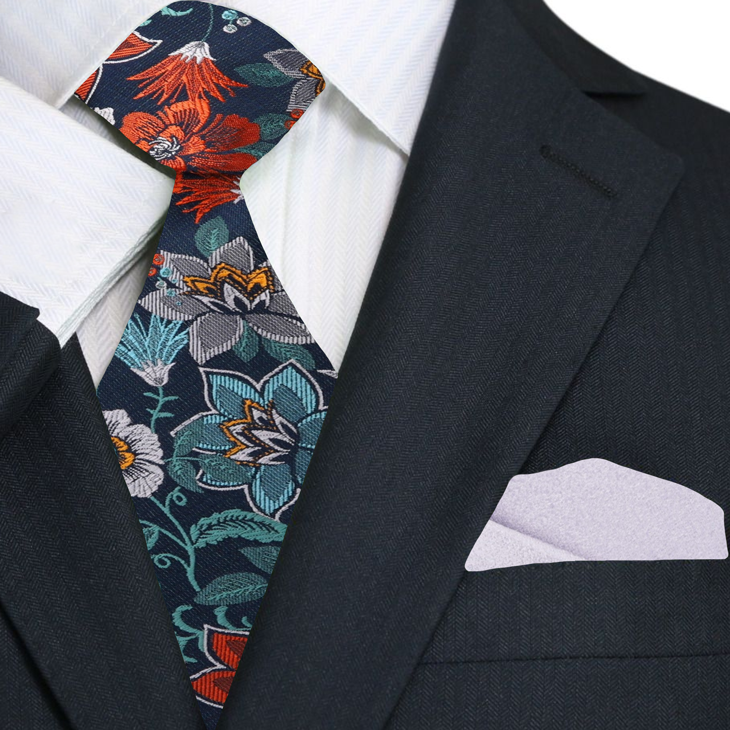 Close-up of the colorful floral patterns on the teal silk tie, highlighting its intricate details.