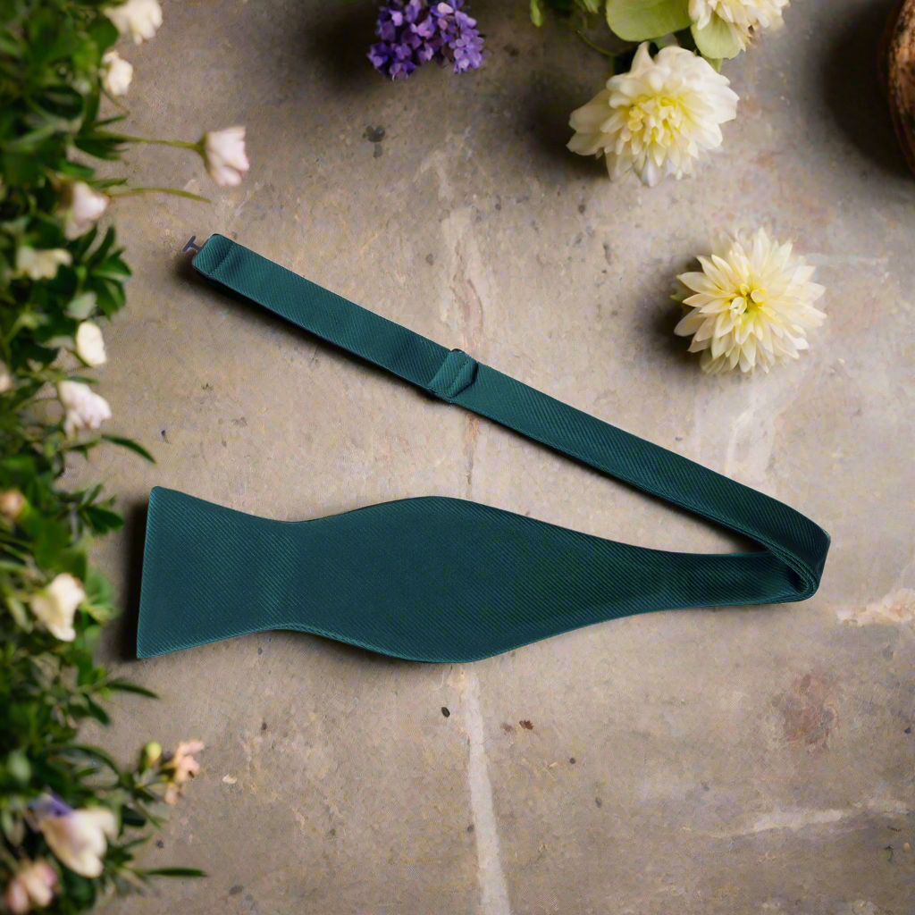 Classic solid color bow tie in royal blue, perfect for formal events.