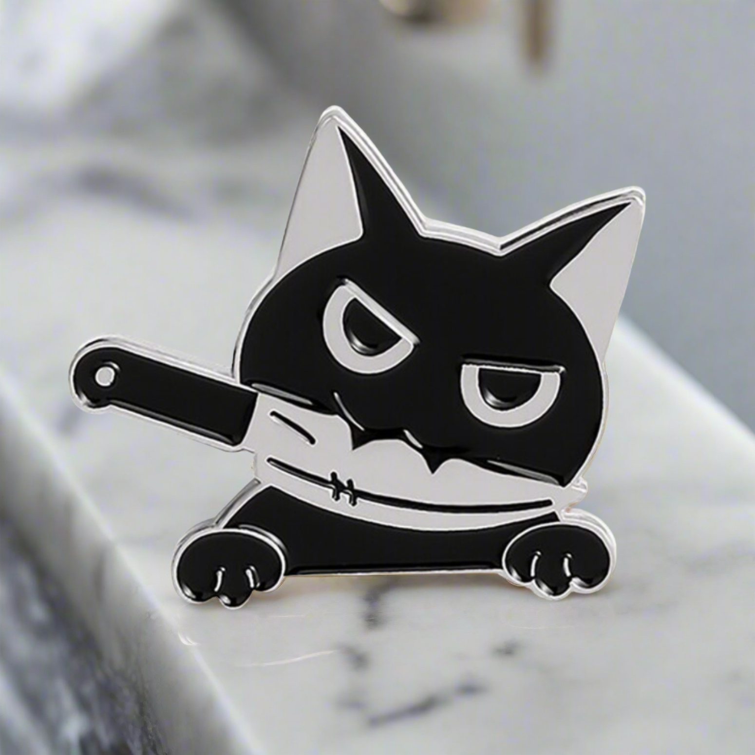 Front view of the whimsical cat lapel pin, highlighting its playful charm.