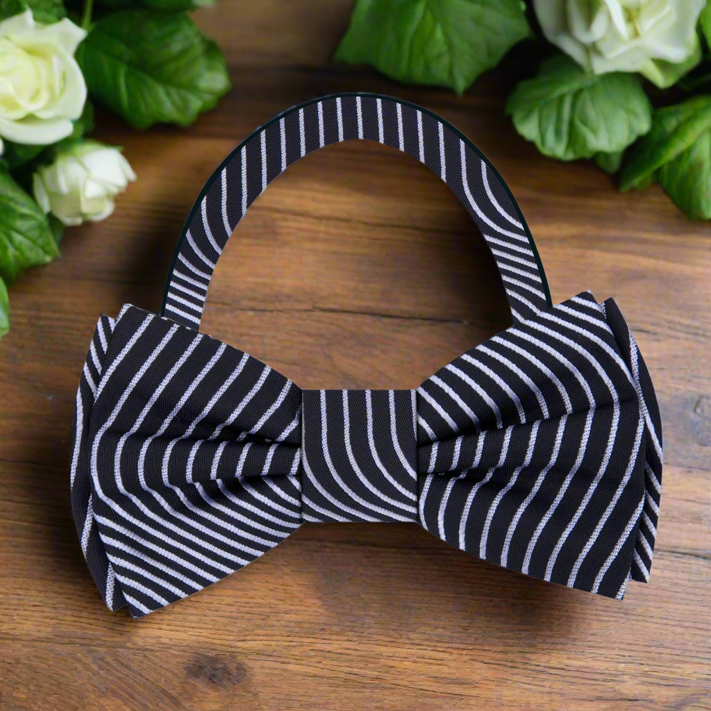 Celestial Elegance bow tie displayed on a tailored suit, showcasing its exquisite silk texture and pattern.