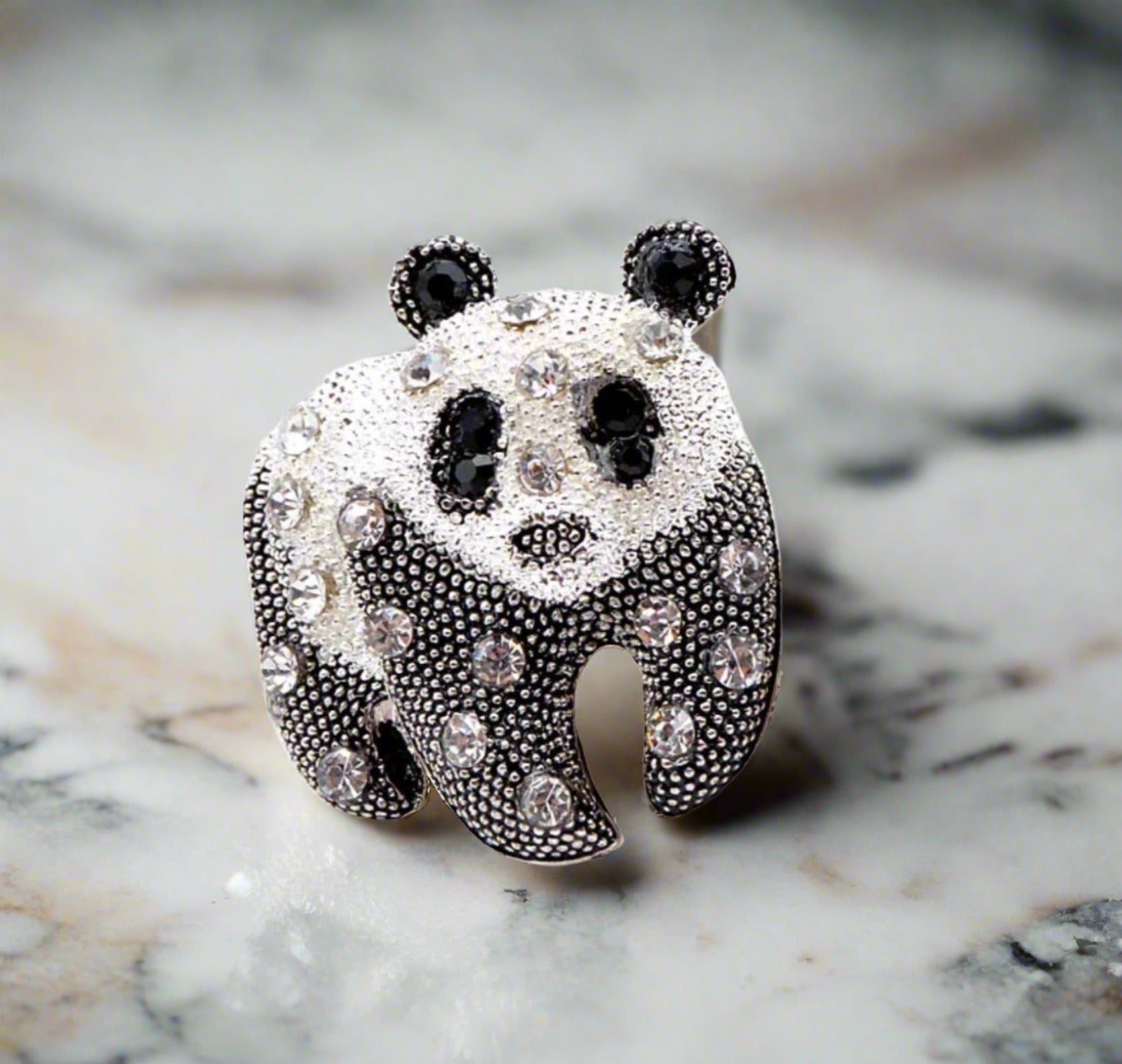 Close-up of a gemstone exotic animal pin with vibrant colors, ideal for fashion accessories and gifts
