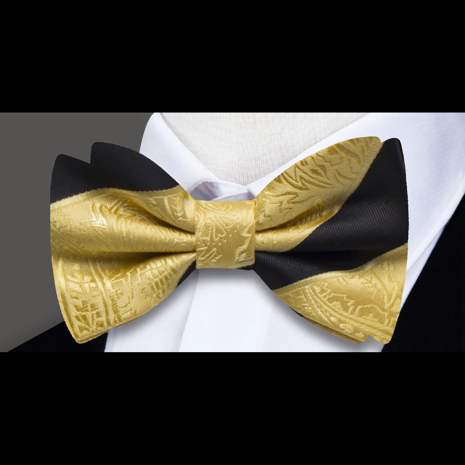 Close-up of the luxurious bow tie showcasing intricate details in paisley and stripes.