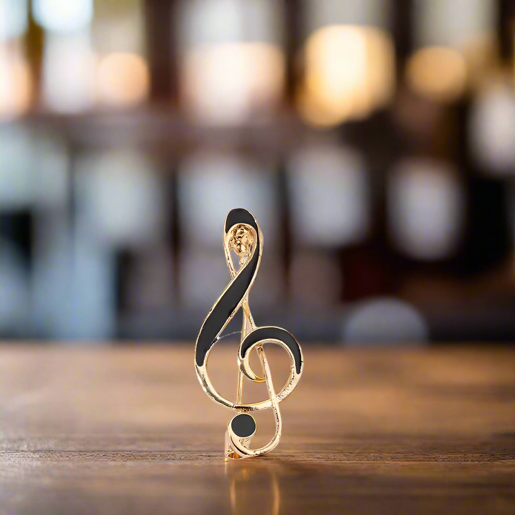 Close-up of a silver music note lapel pin for musicians