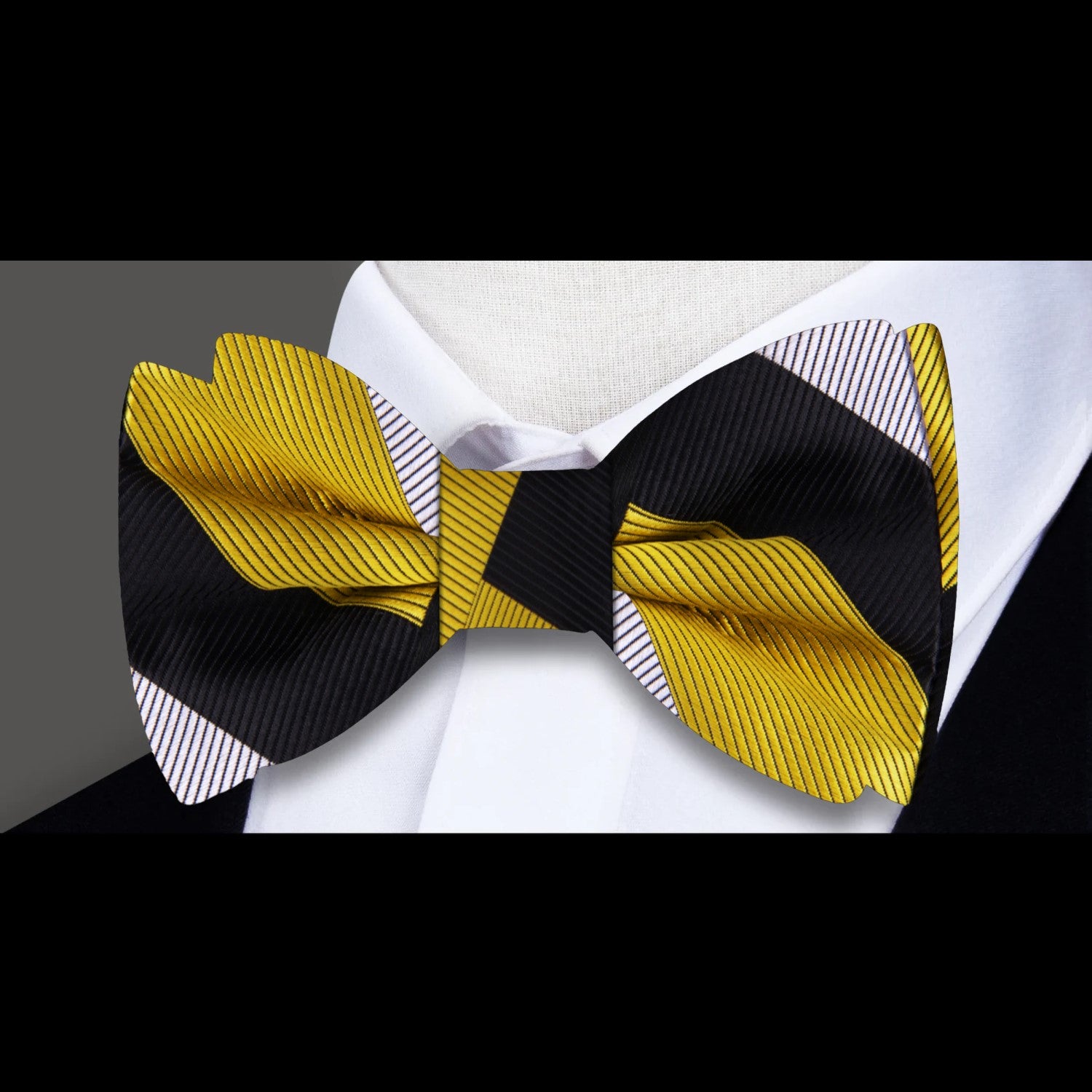 Flat lay of the bow tie and matching pocket square, highlighting the silk texture and bold color combinations