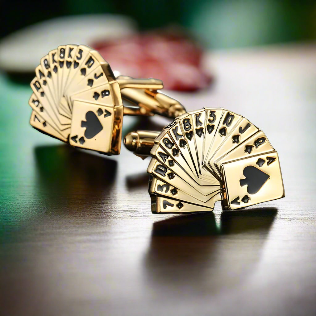 Close-up of chrome playing cards cufflinks on a dress shirt