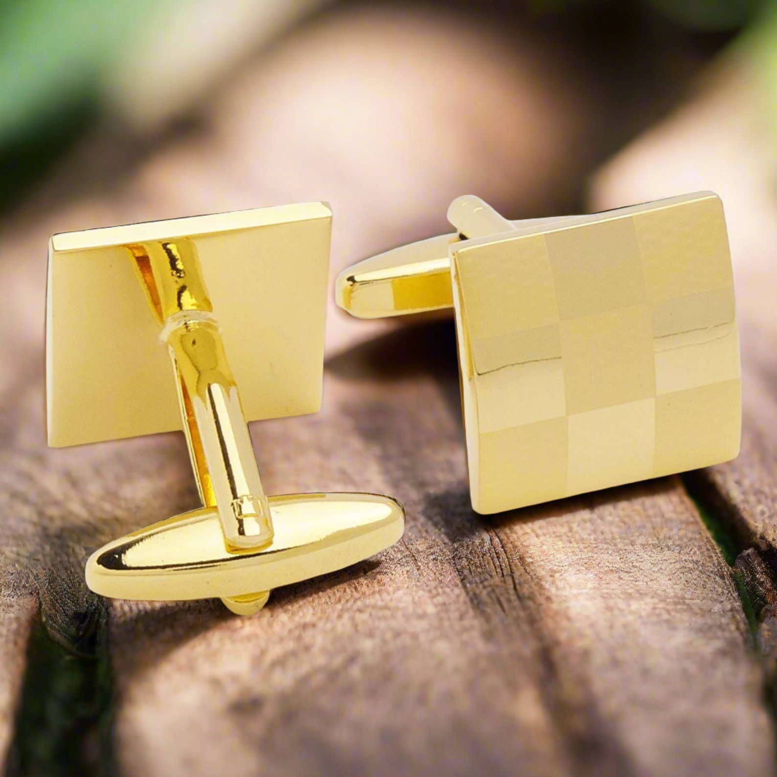 Gold square cufflinks displayed on a classic white dress shirt, emphasizing their stylish appeal.