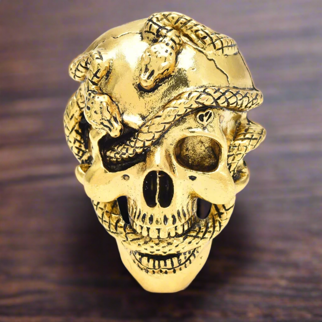Mens skull lapel pin worn on a black suit, adding a touch of elegance and edge.