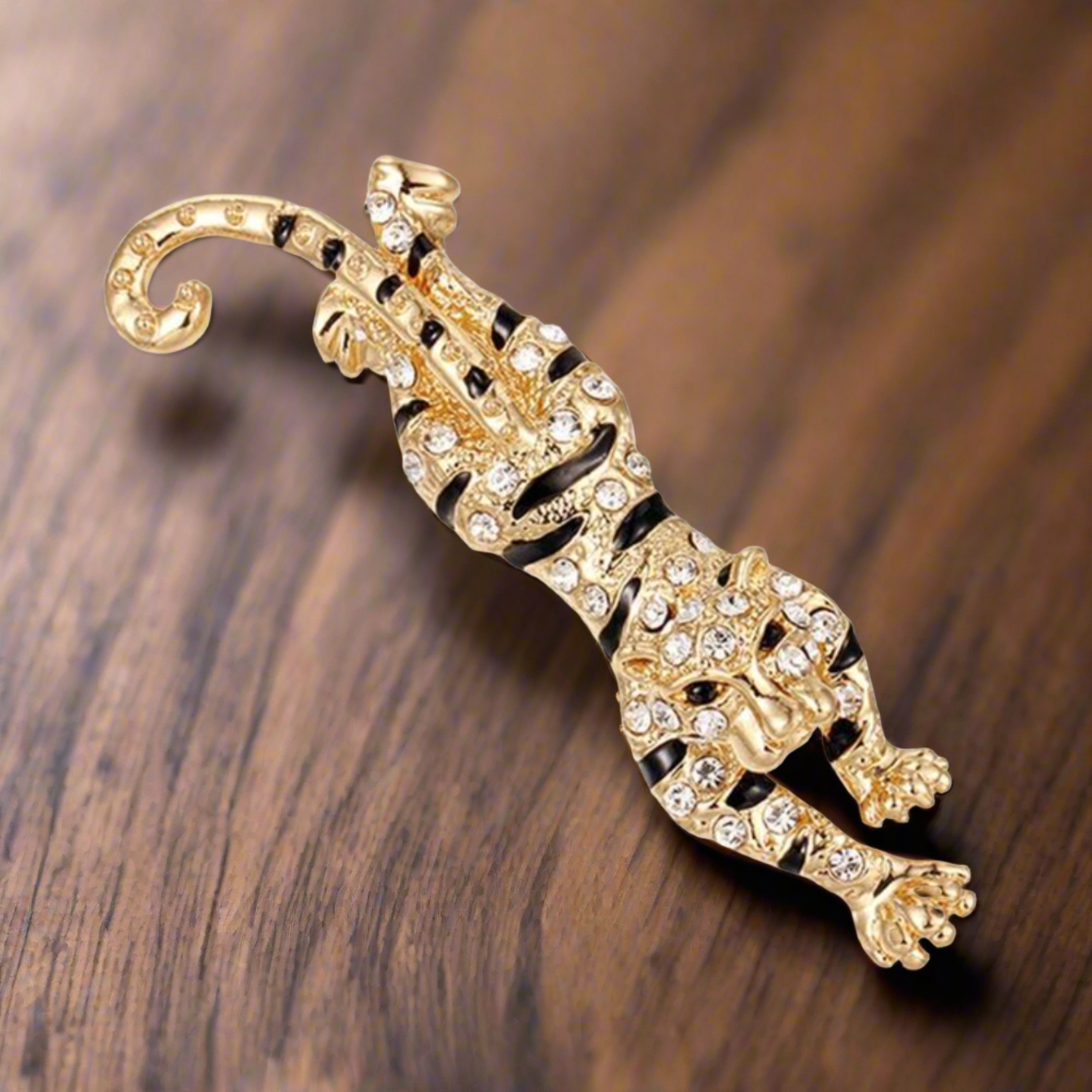 Colorful exotic animal pins with gemstones displayed for gift ideas
