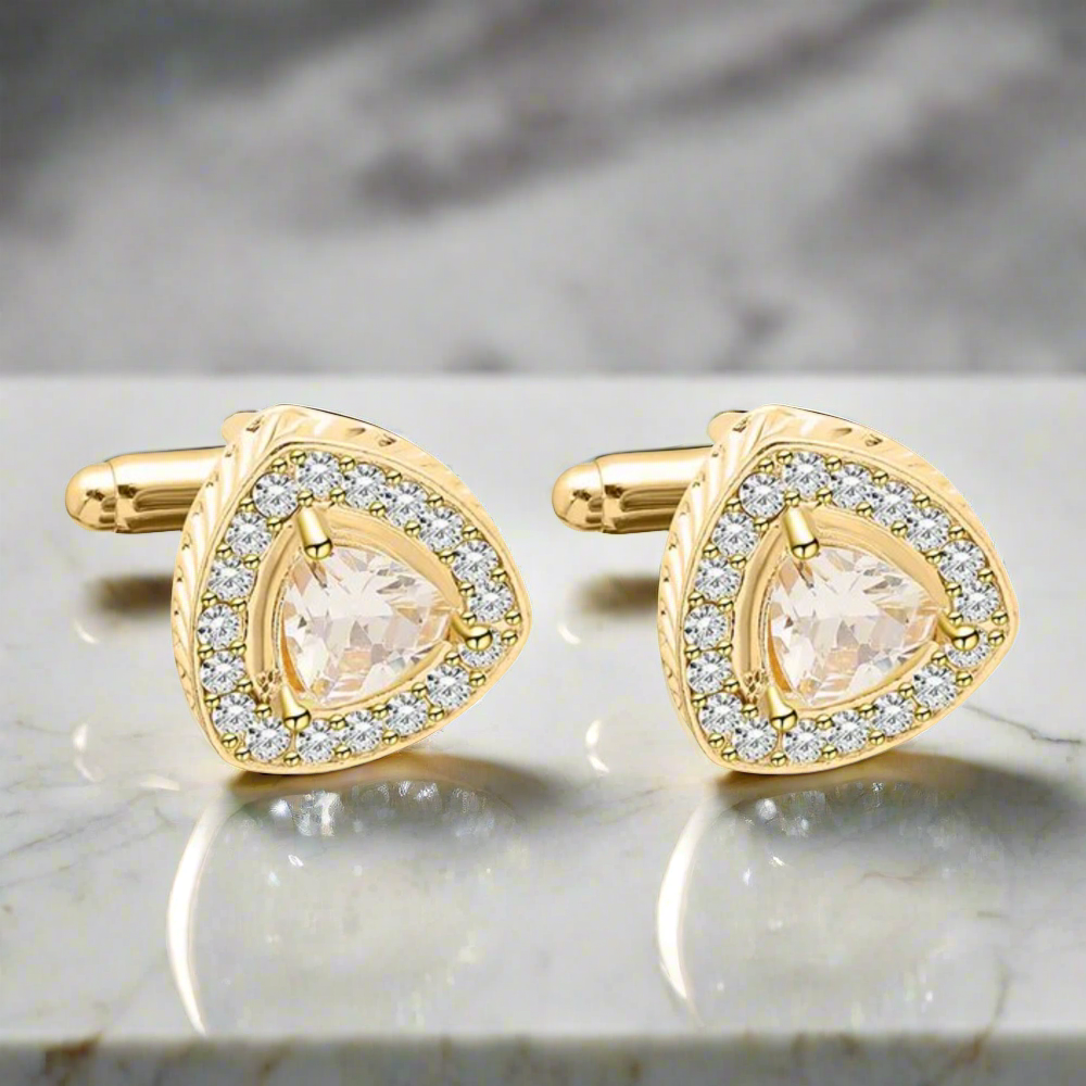 Elegant diamond-shaped cufflinks in gold with amber stone, perfect for formal occasions.