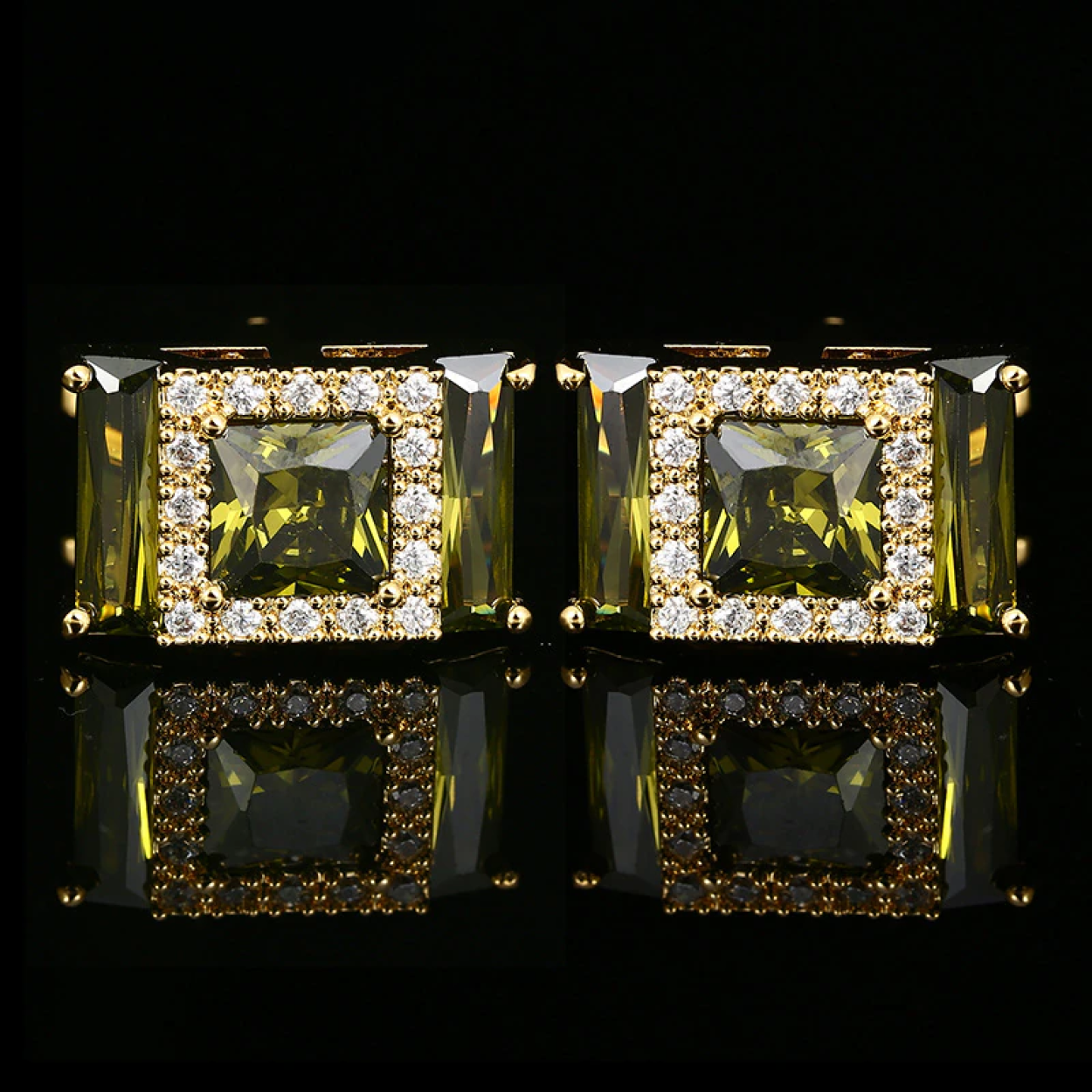 Gold gemstone cufflinks with clear stones, showcasing a luxurious design.