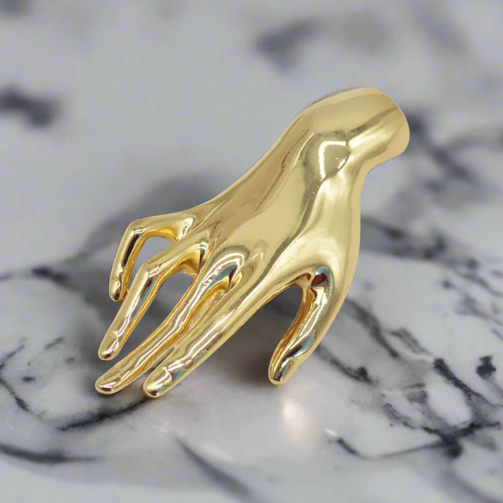 Elegant gold lapel pin worn with formal shirt and blazer