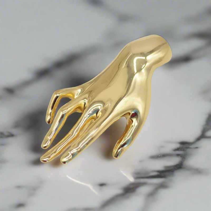 Stylish mens accessories featuring a gold hand lapel pin for special occasions