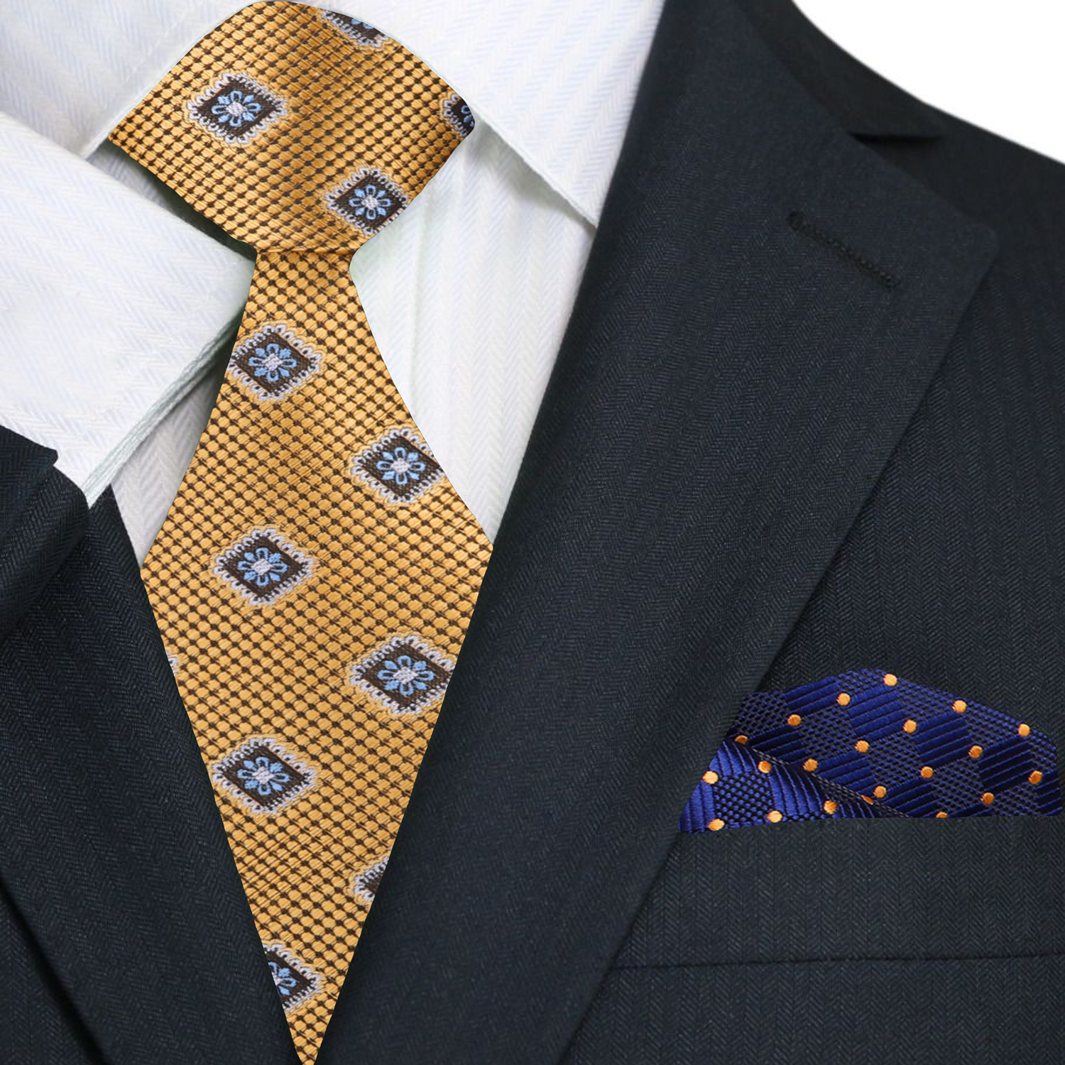 Close-up detail of the gold medallion necktie highlighting the intricate design and texture.