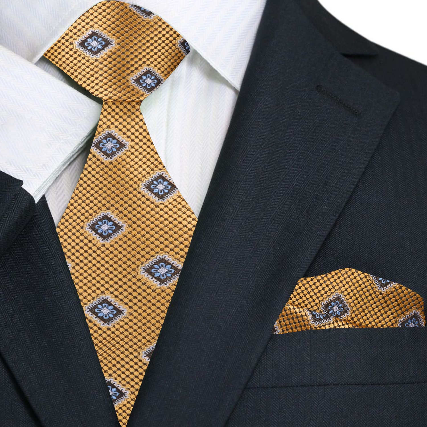 Close-up detail of the gold medallion necktie highlighting the intricate design and texture.