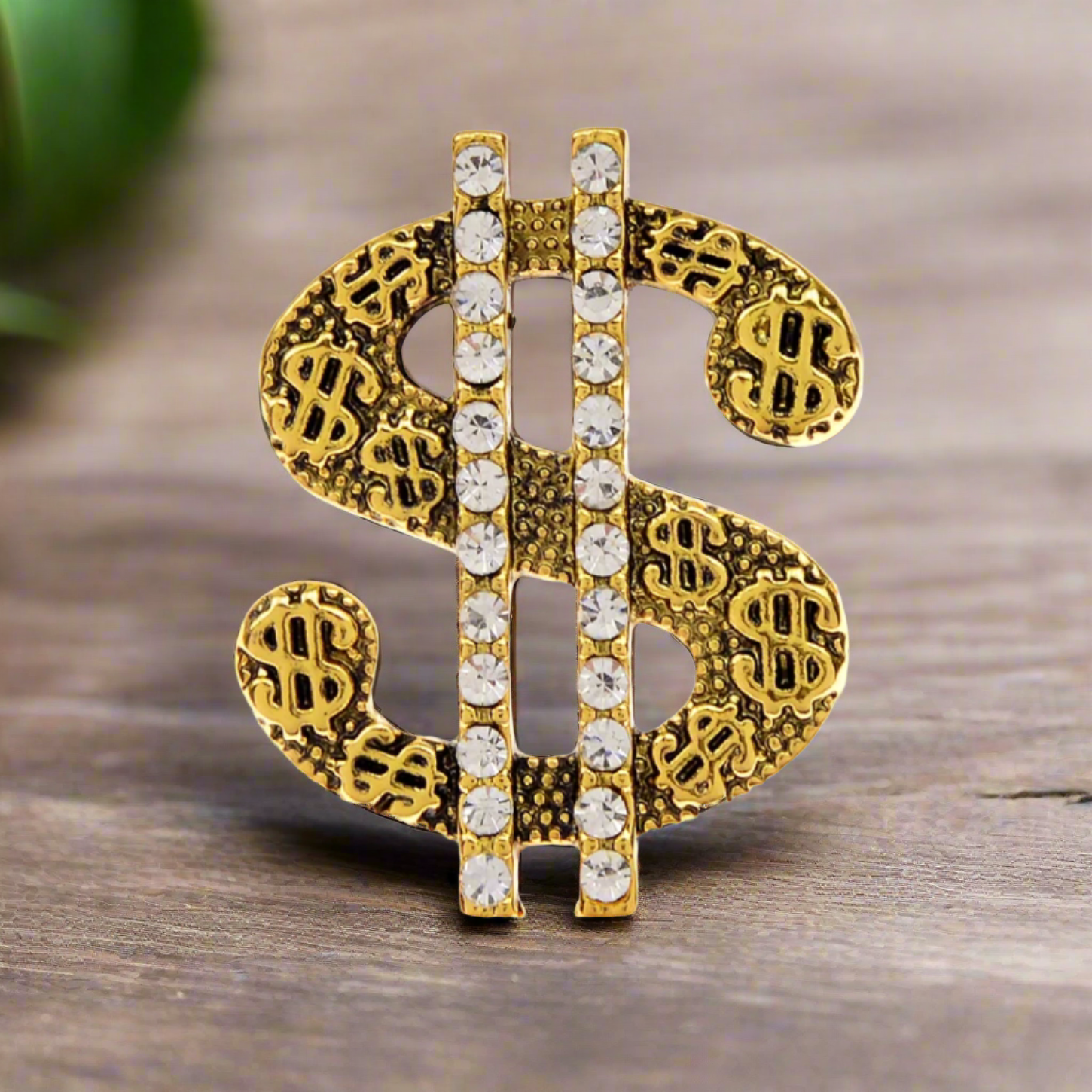 Gold and Chrome Wealth Rhinestone Lapel Pin worn on a suit lapel, highlighting its elegant design.