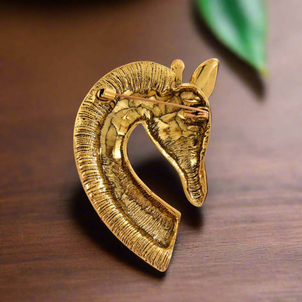 Whimsical Giraffe Rhinestone Lapel Pin displayed on a jacket