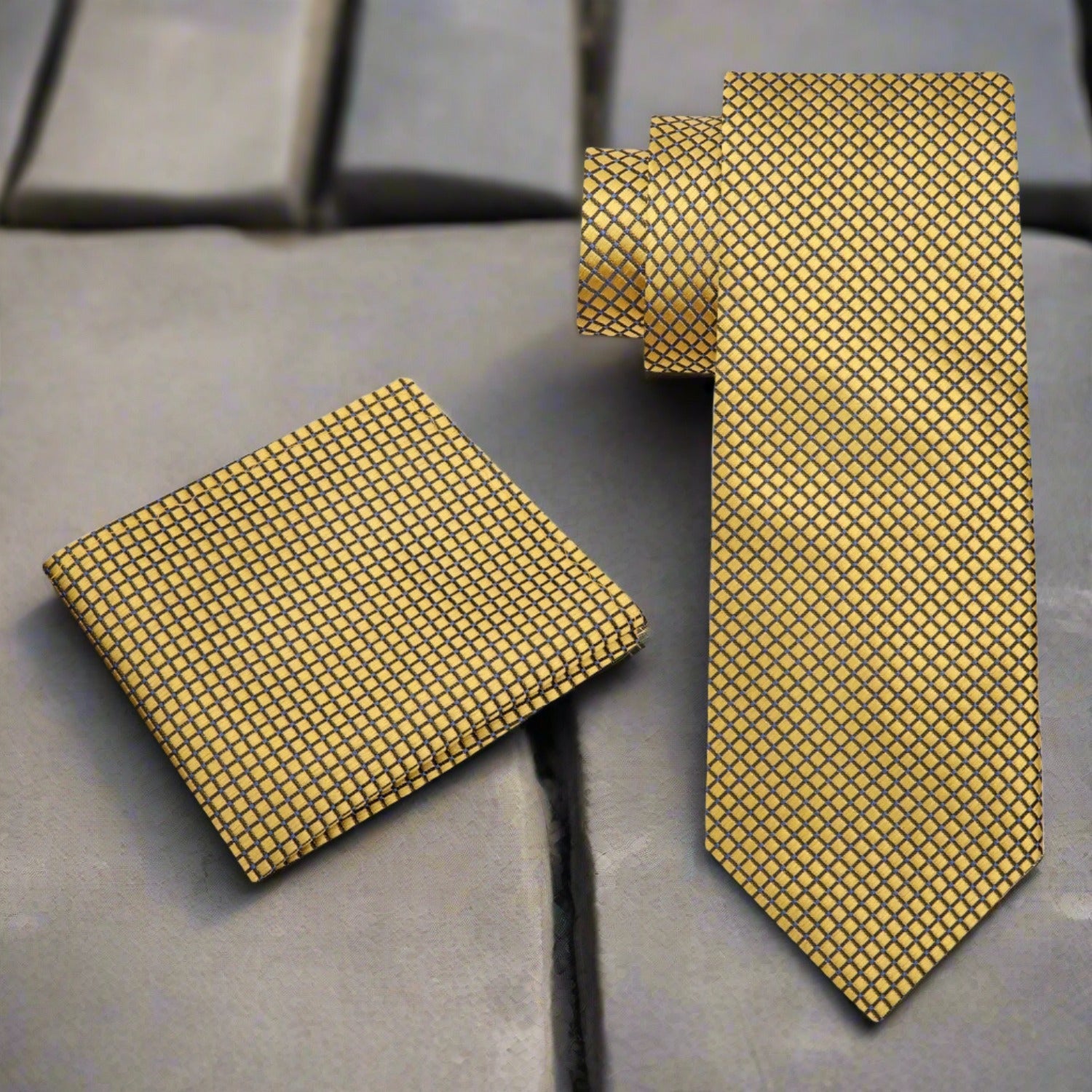 Close-up of the opulent gold geometric silk necktie showcasing its intricate design and texture.