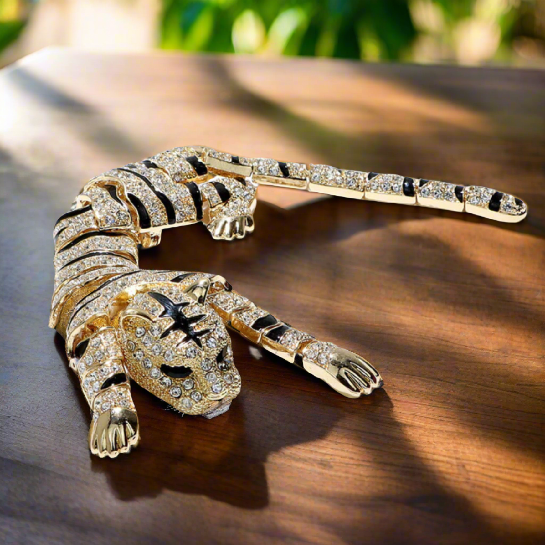 Close-up view of the Majestic Tiger Shoulder Lapel Pin in gold finish, highlighting intricate details and gemstones.