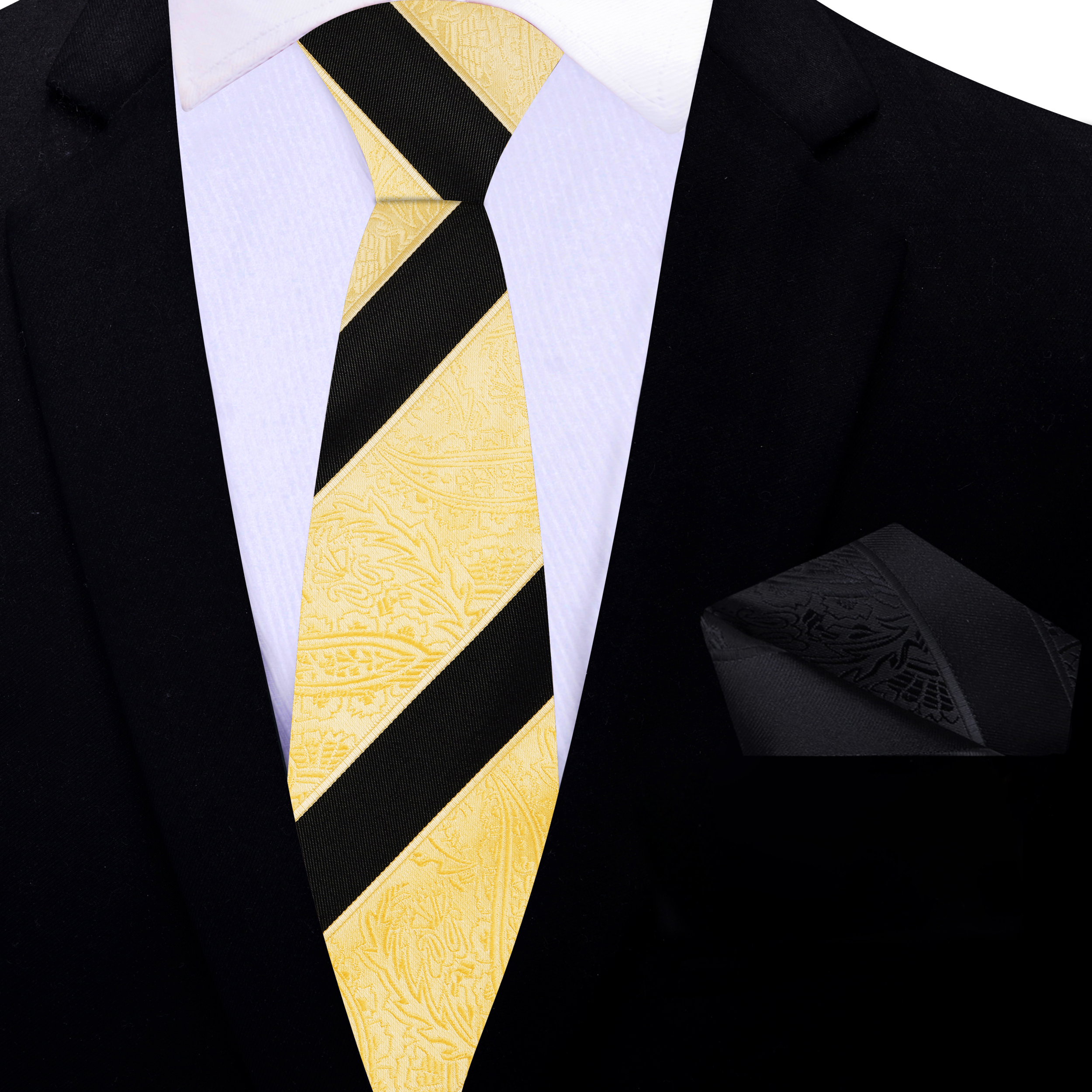Man wearing a stylish black suit with gold and black paisley silk tie at a formal event
