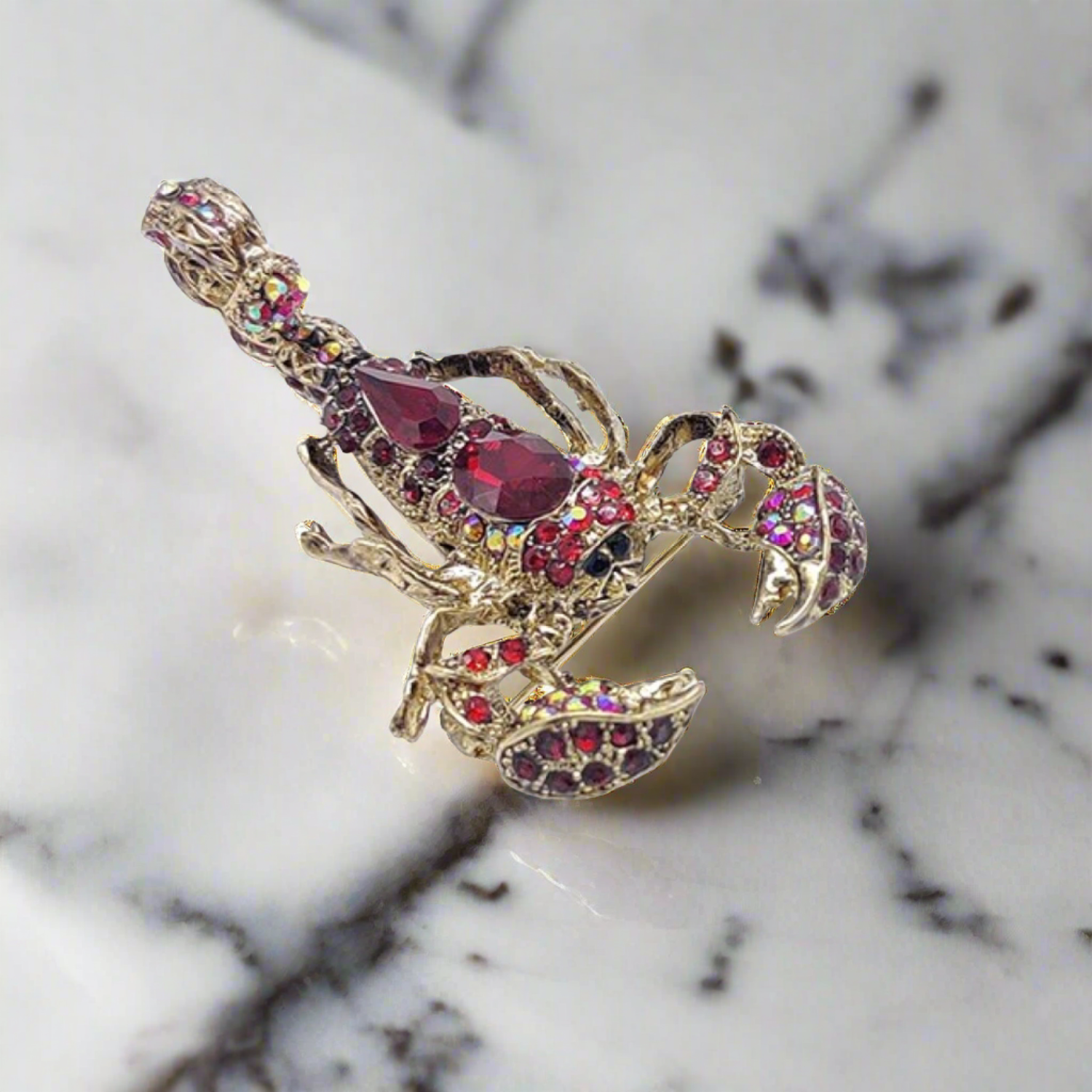 Close-up of a gemstone exotic animal pin with vibrant colors, ideal for fashion accessories and gifts
