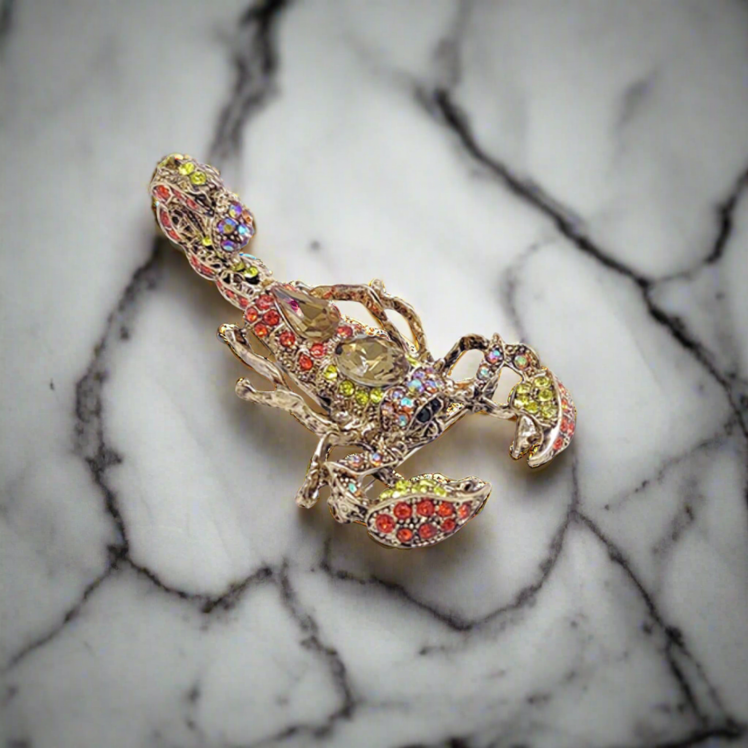 Front view of a gemstone exotic animal lapel pin with lion design, showcasing intricate detail and sparkling gemstones