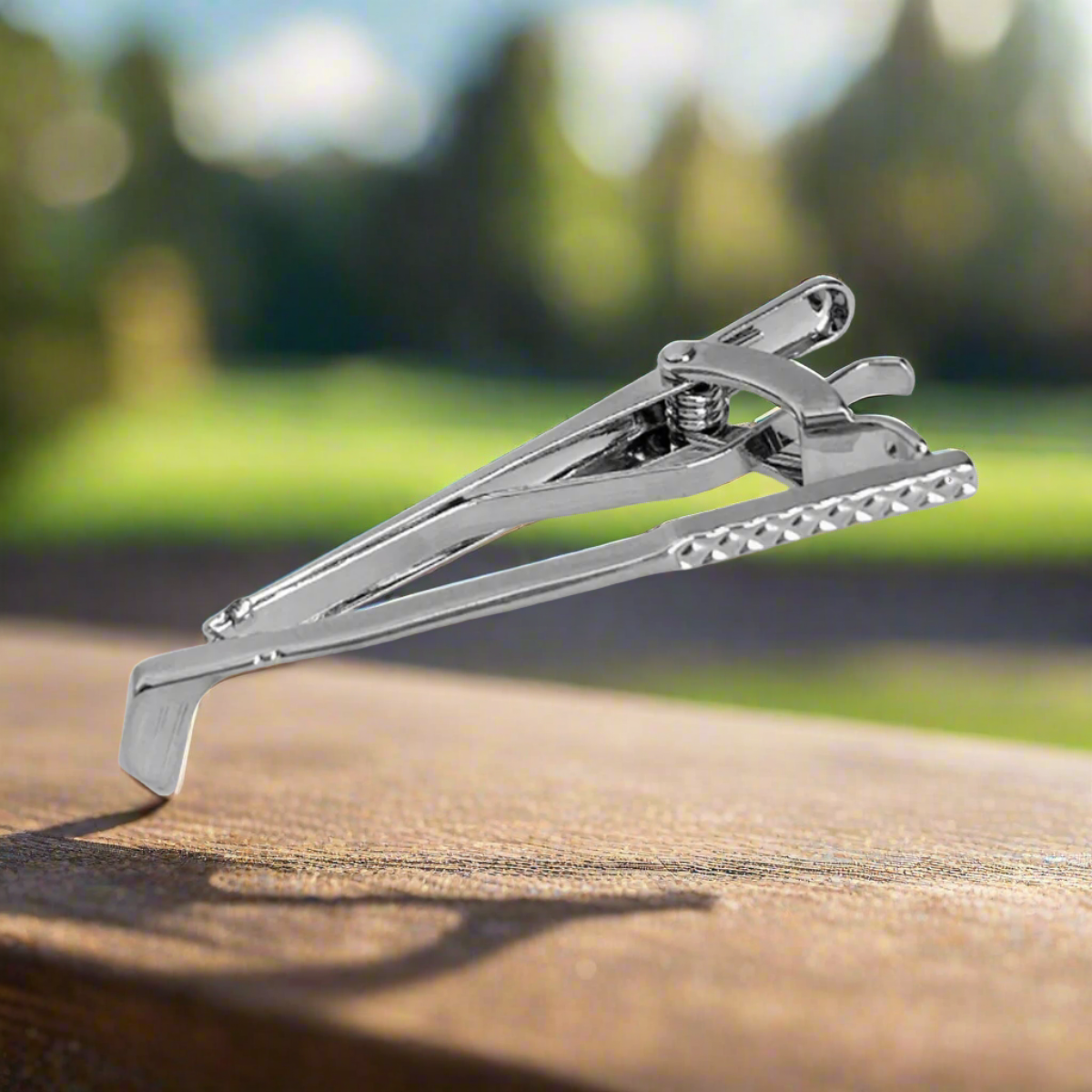 Golf tie clip featuring golf club design on a dress shirt, ideal for golf enthusiasts
