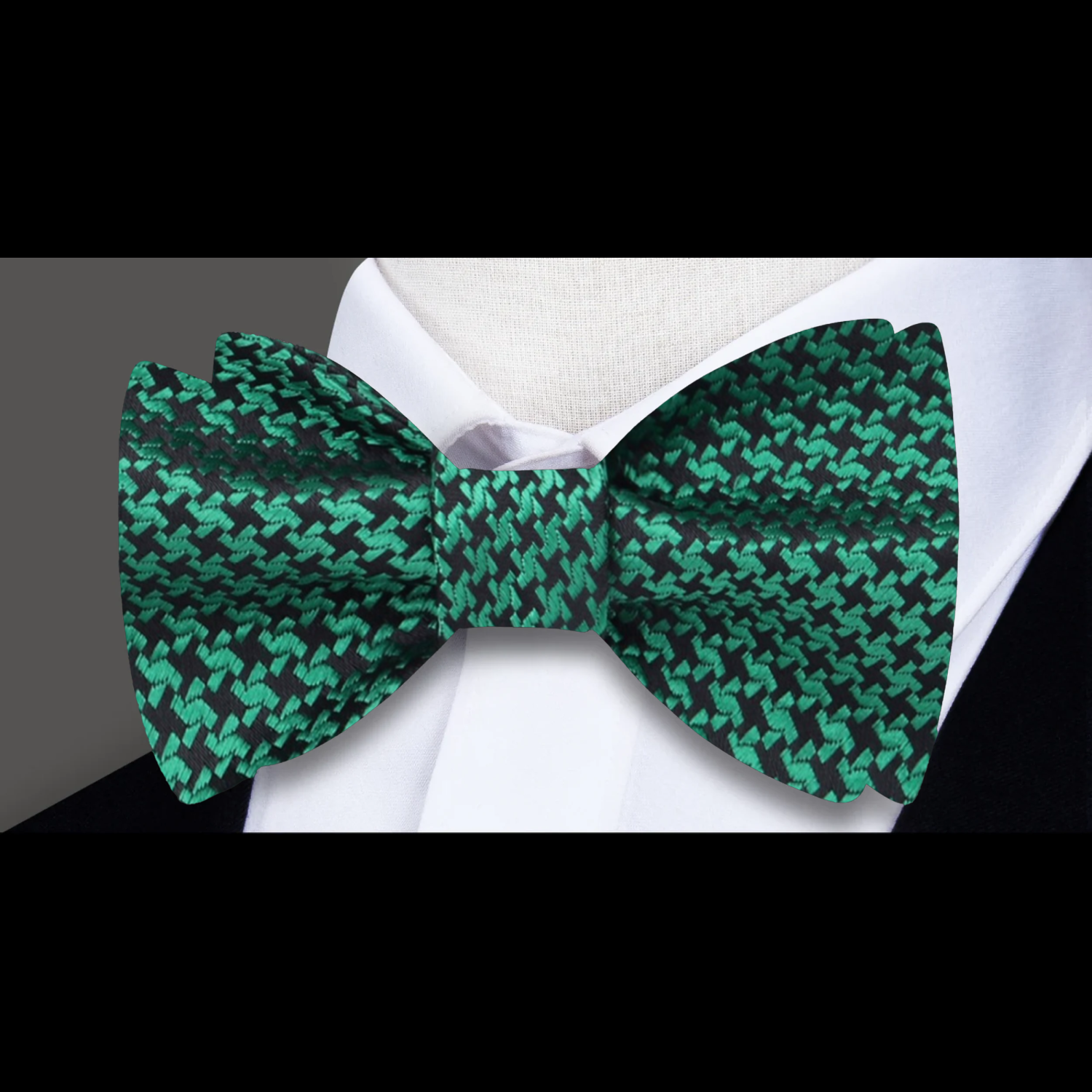 Pre-tied black houndstooth silk bow tie with matching pocket square for upscale gatherings