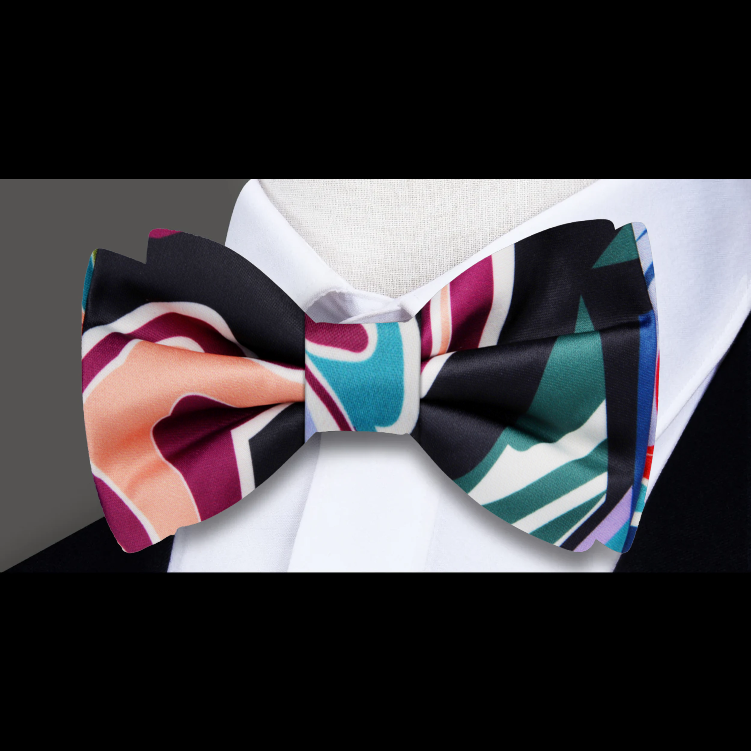 Close-up of unique abstract silk bow tie detailing.