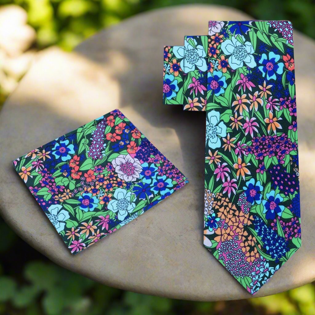 Silk floral necktie styled with navy suit for garden party