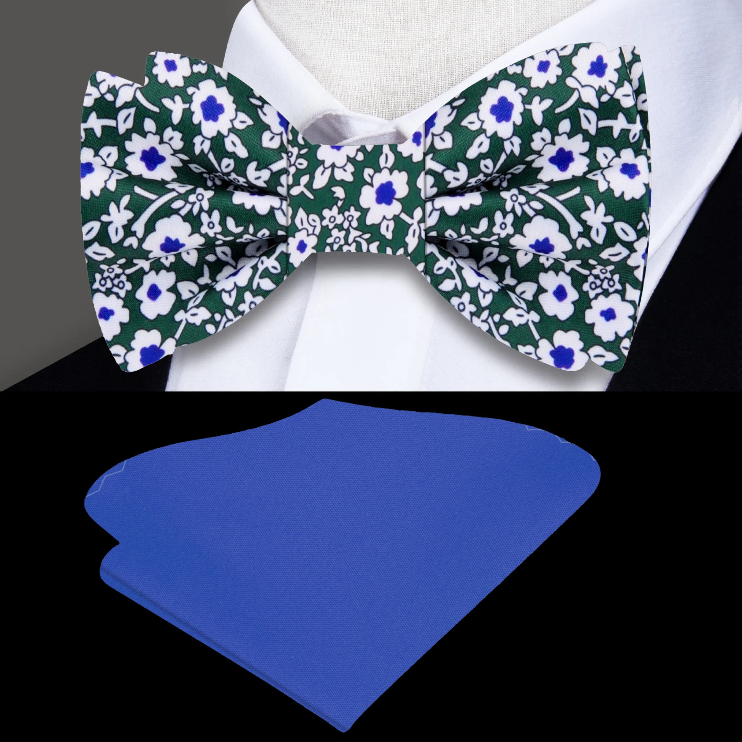 Close-up of a silk bow tie with floral design in green, white, and blue, styled for wedding attire