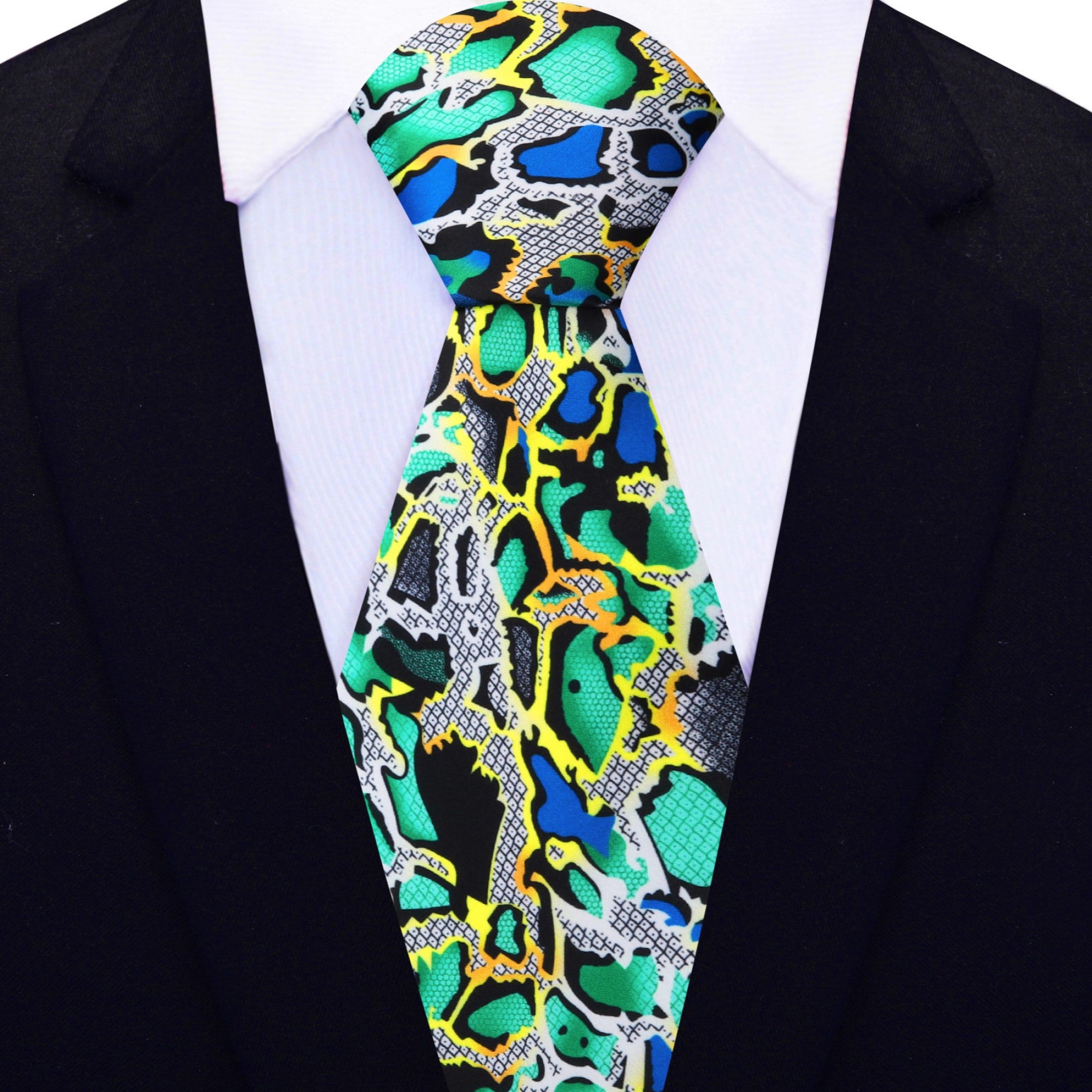 Man wearing a snake skin silk tie paired with a navy suit at a high-profile event