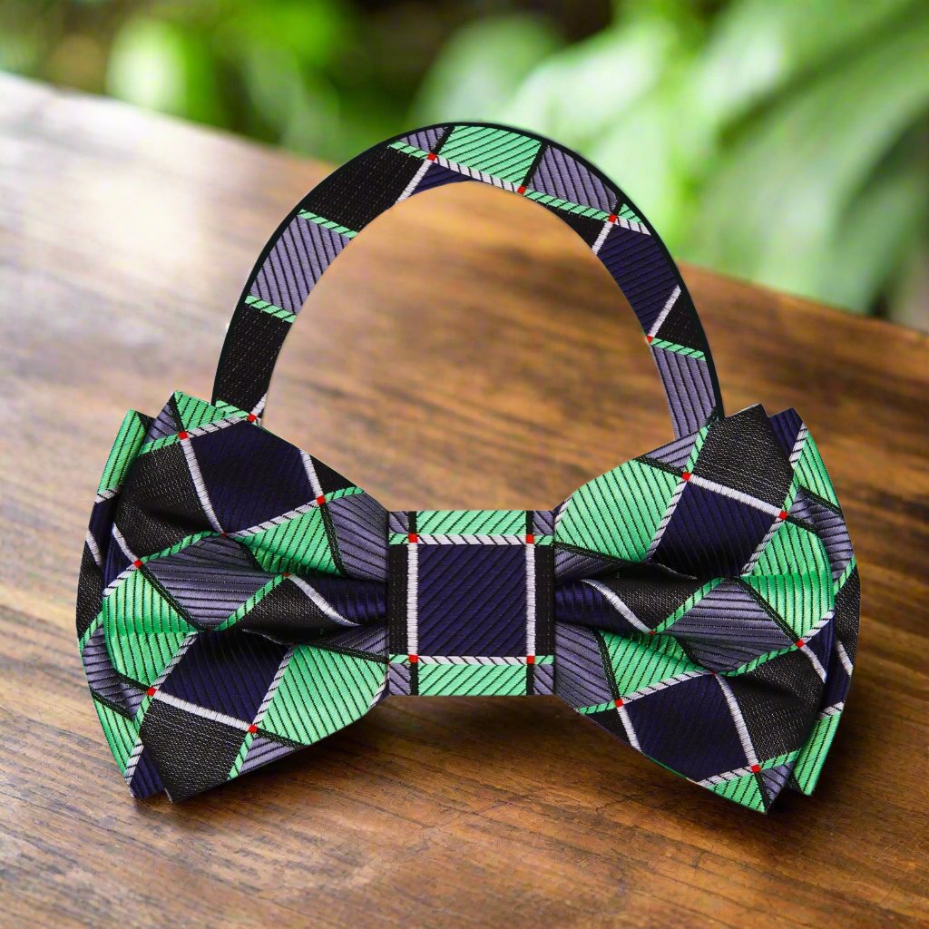 Man wearing a geometric silk bow tie with a matching pocket square, stylish and modern