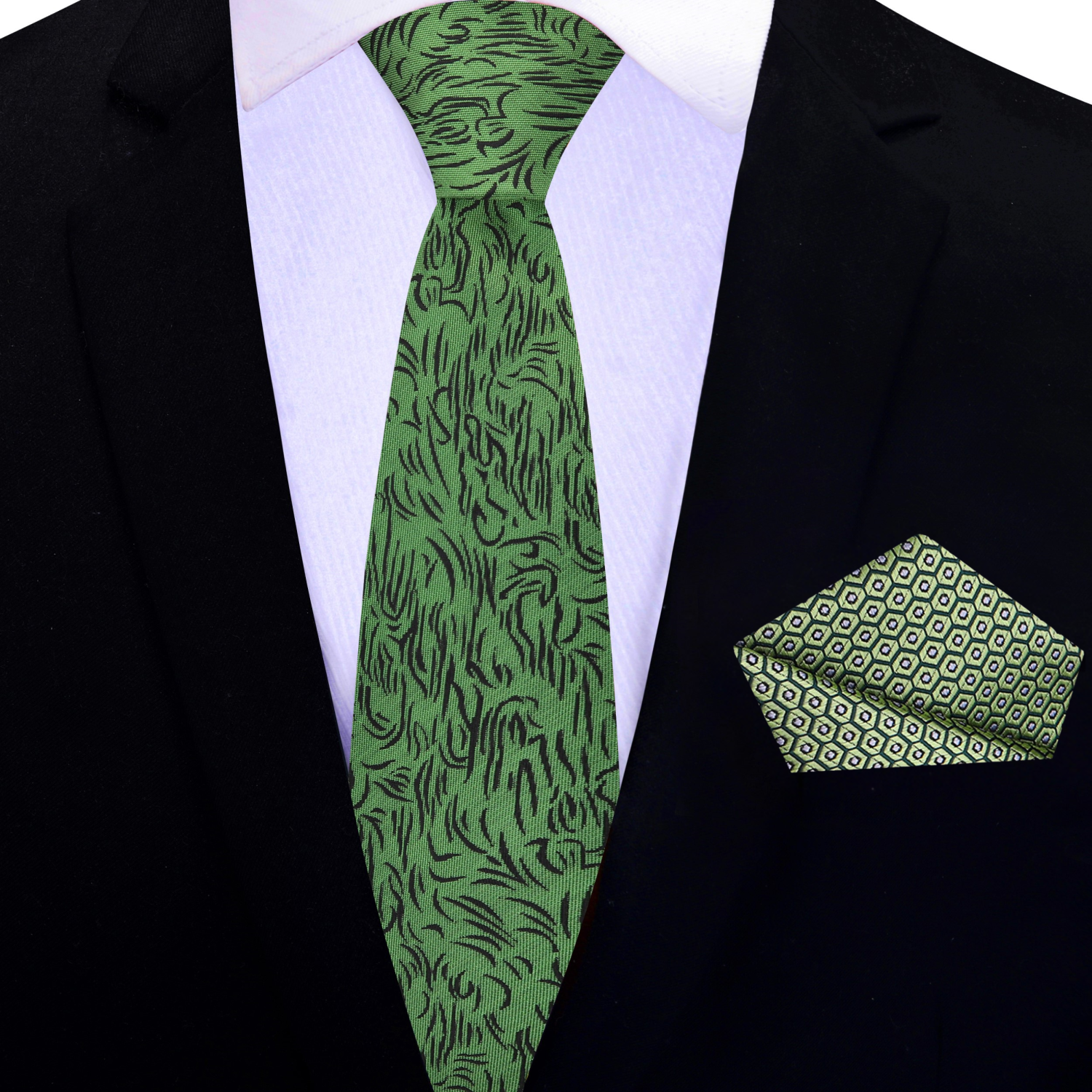 Man wearing the green silk necktie with black pattern paired with a charcoal grey suit for a formal event