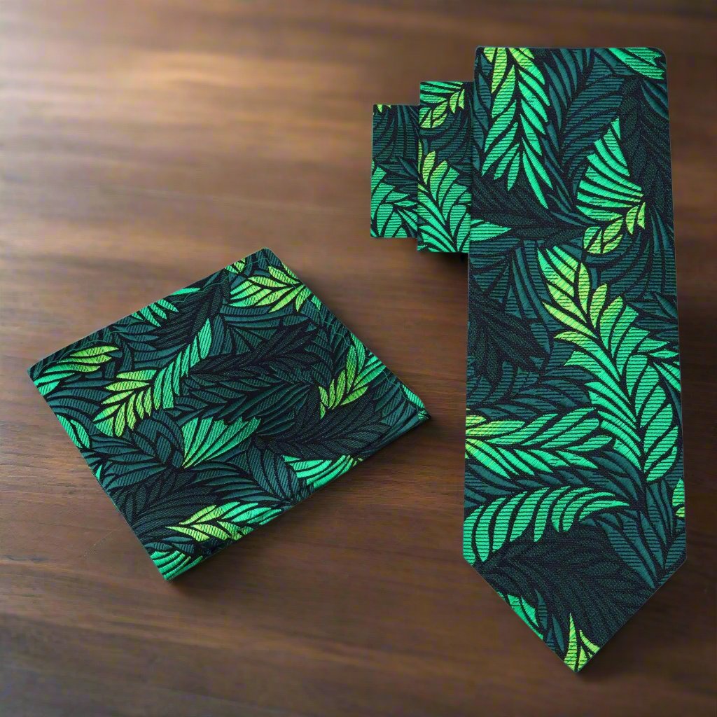 Close-up of the abstract feather design on a mens green silk necktie