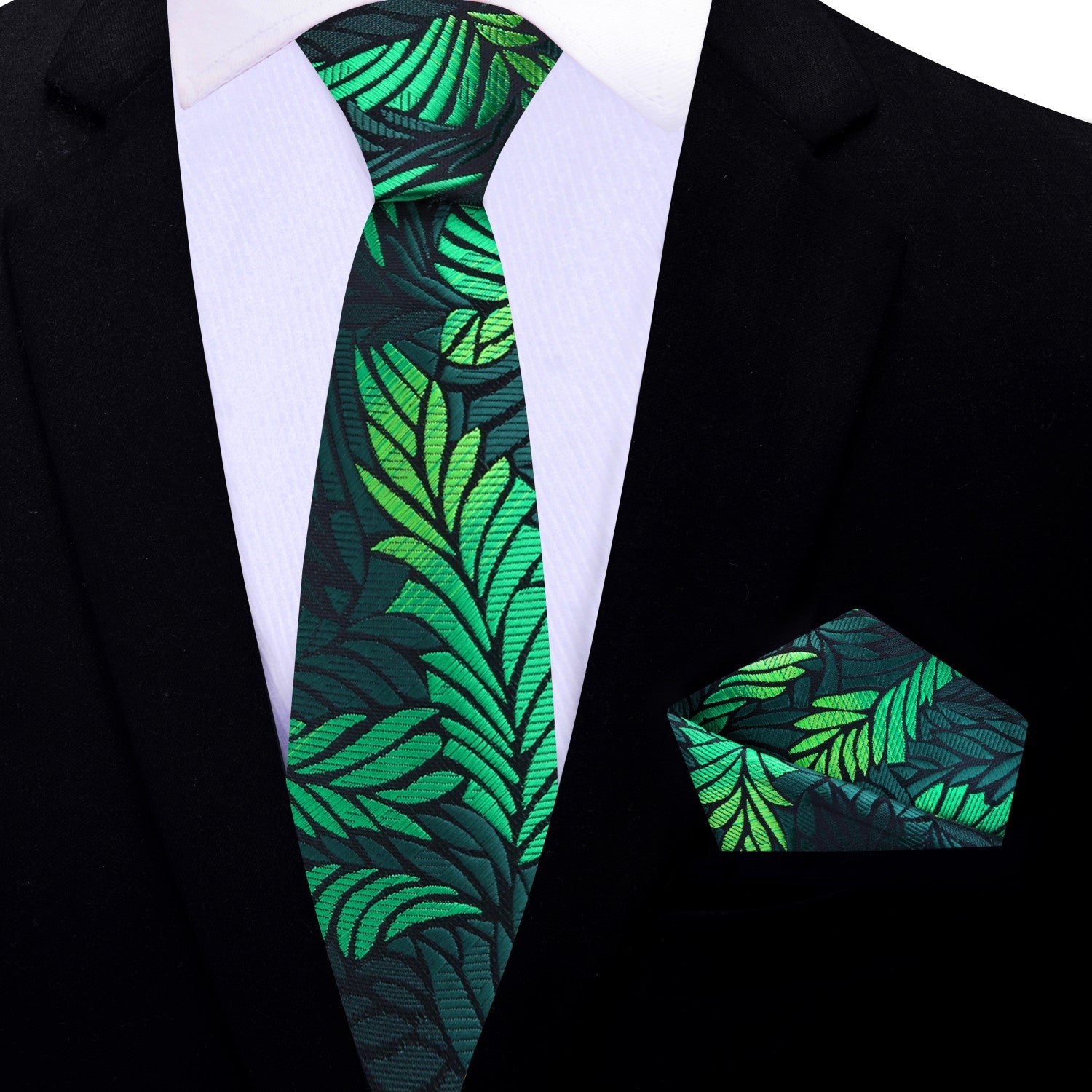 Elegant green feather patterned silk necktie styled with a navy suit for formal events