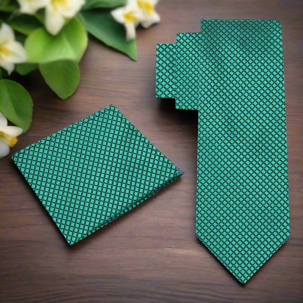Green geometric silk tie styled with a navy suit, ideal for weddings or business meetings.