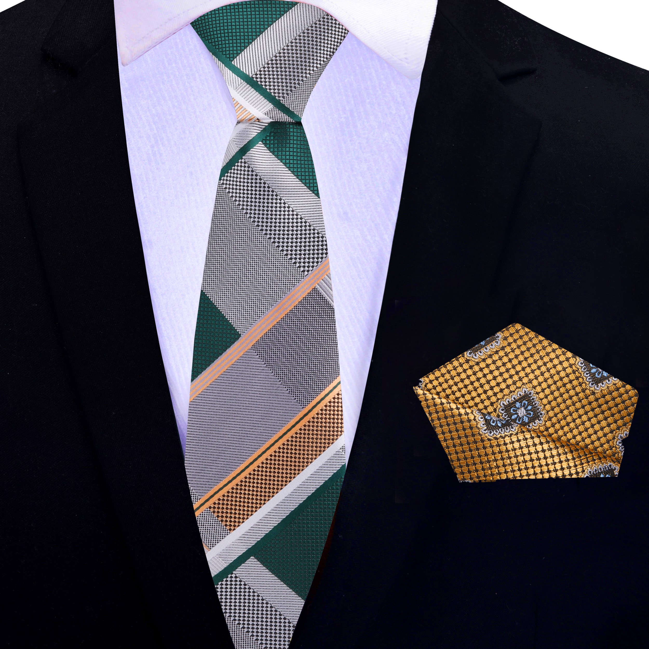 The grey plaid necktie paired with a charcoal grey suit, demonstrating its versatility for both formal and casual events.