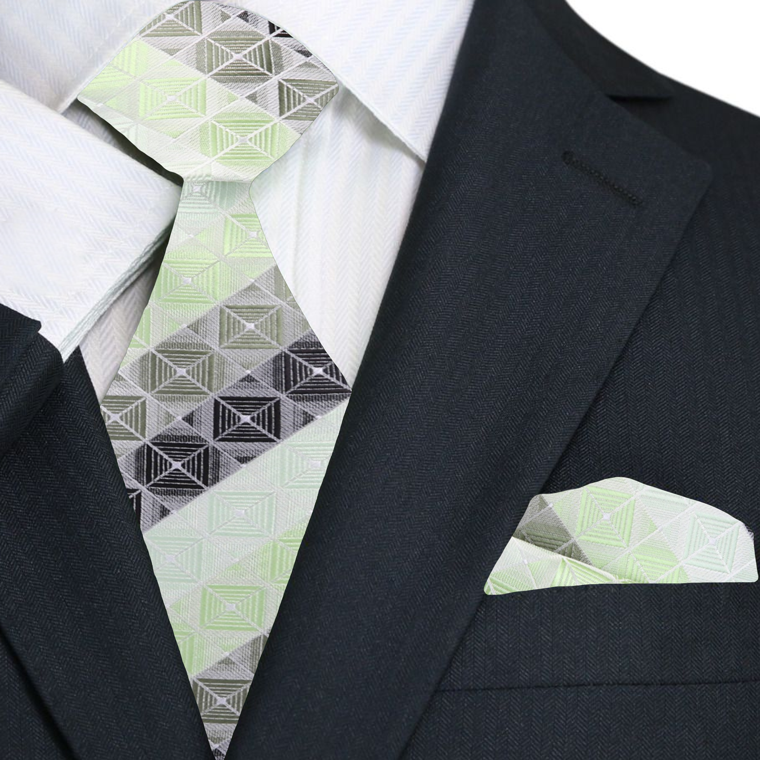 Silk necktie with geometric blocks pattern in green and grey, styled with a white dress shirt