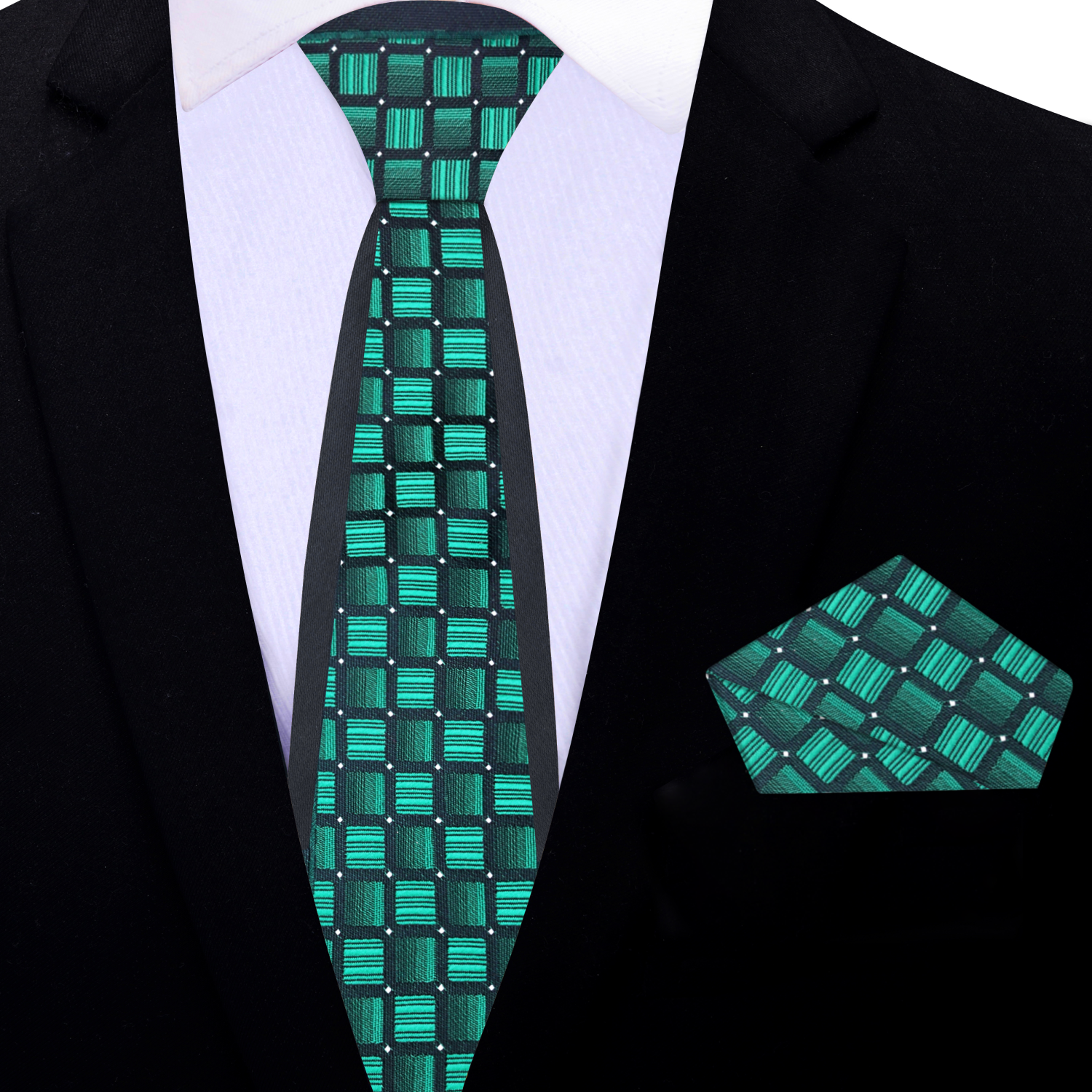 The green silk necktie displayed on a black suit, emphasizing its elegant contrast and sophistication.