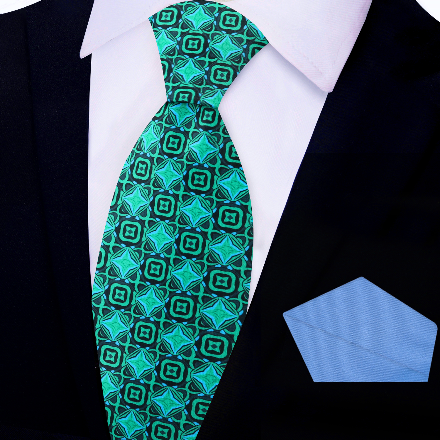 Styled image of the silk tie paired with a suit and pocket square