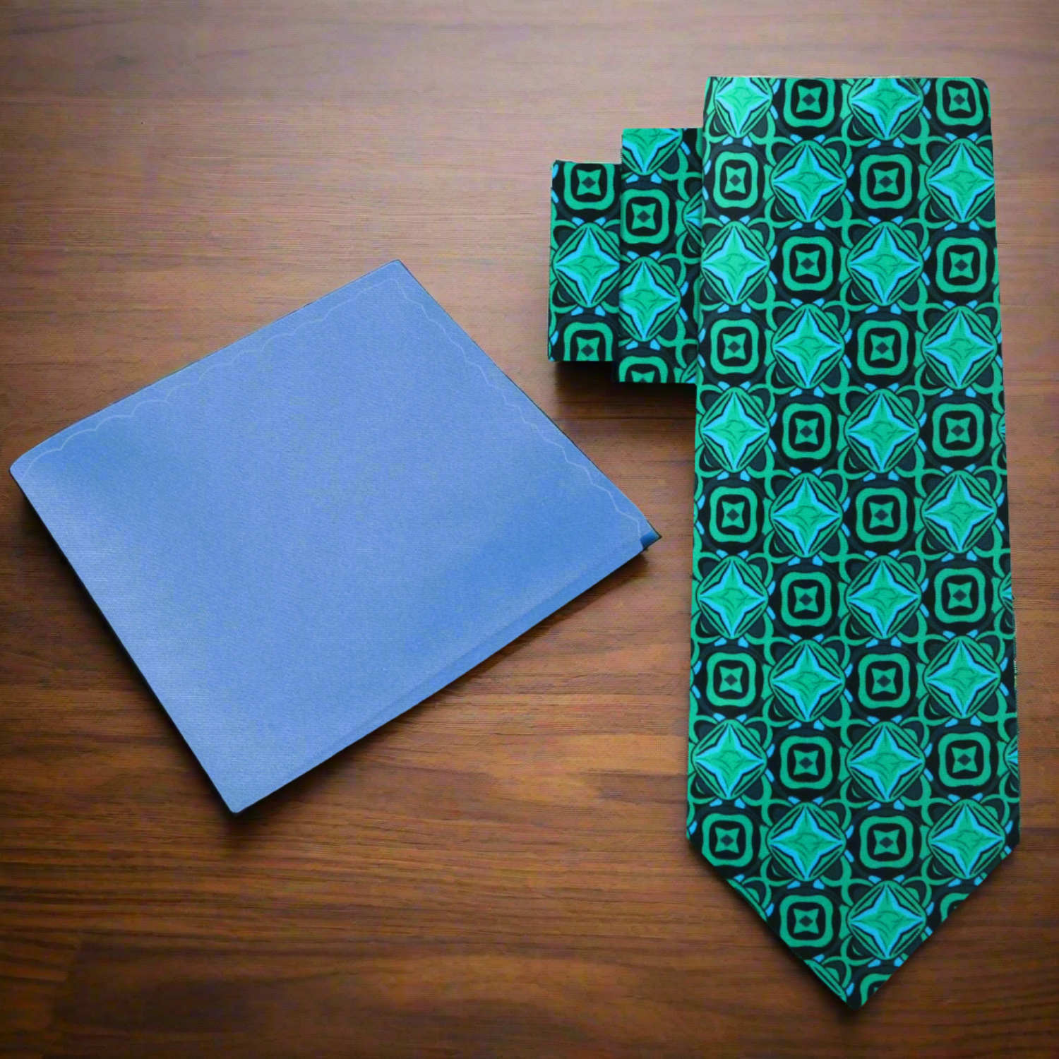 Styled image of the silk tie paired with a suit and pocket square