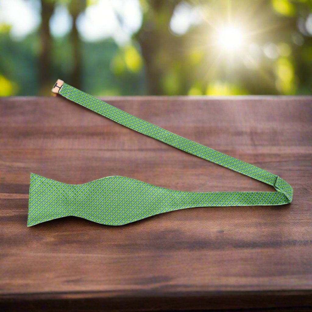 Elegant Green and Blue Check Bow Tie against a white shirt, showcasing its vibrant colors.