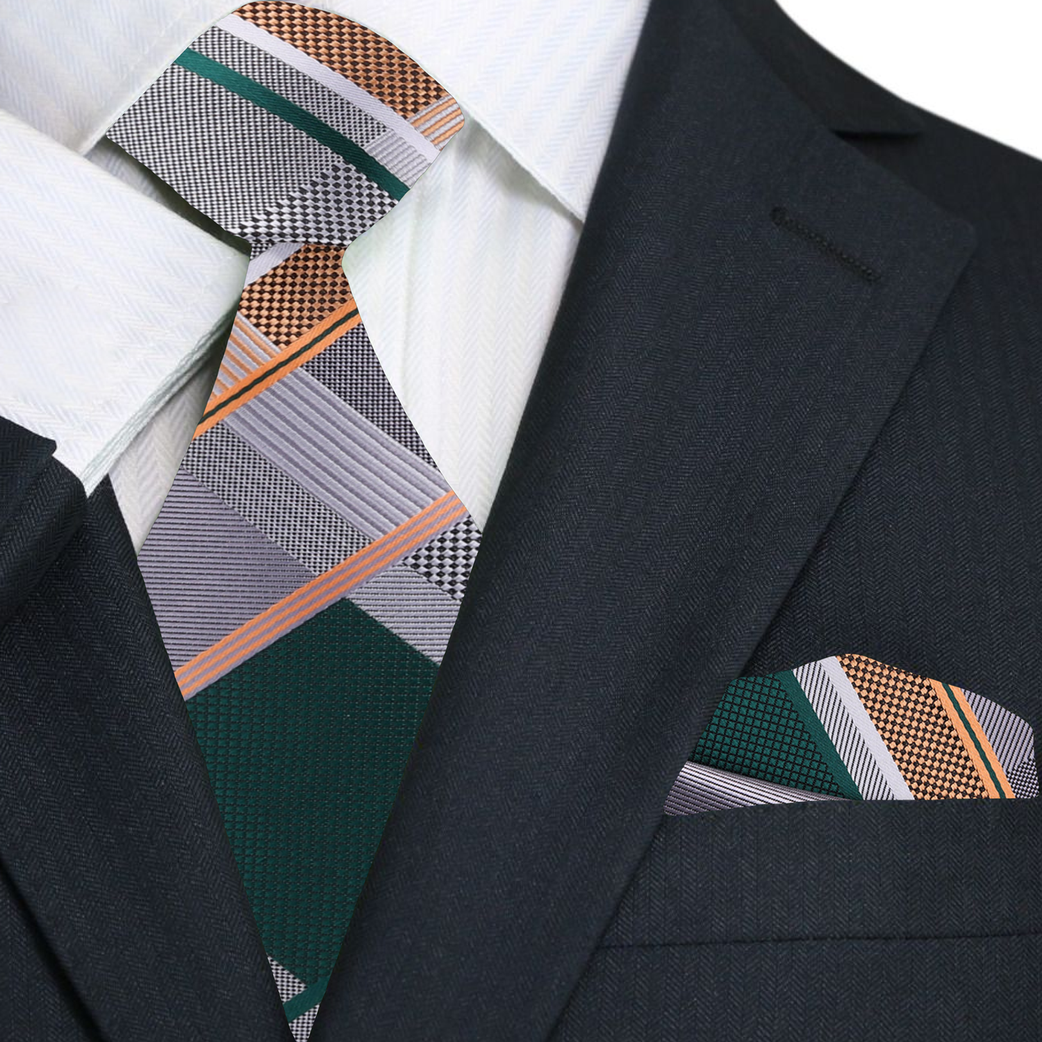 Close-up of the grey plaid tie draped over a white dress shirt, highlighting the ties intricate design and color combinations.